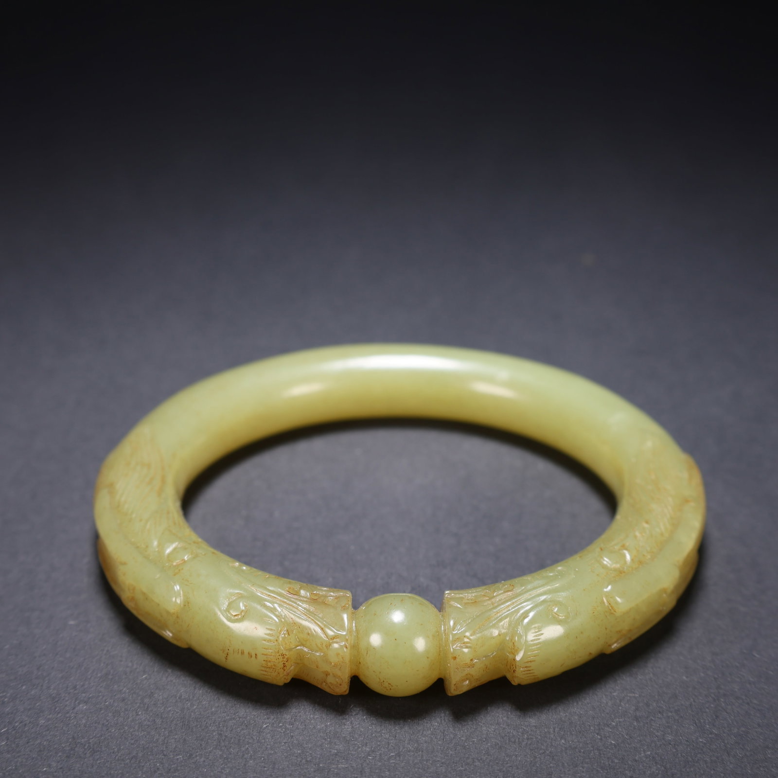 A HETIAN YELLOW JADE "TWO DRAGONS PLAYING WITH A PEARL" BRACELET (1 of 9)