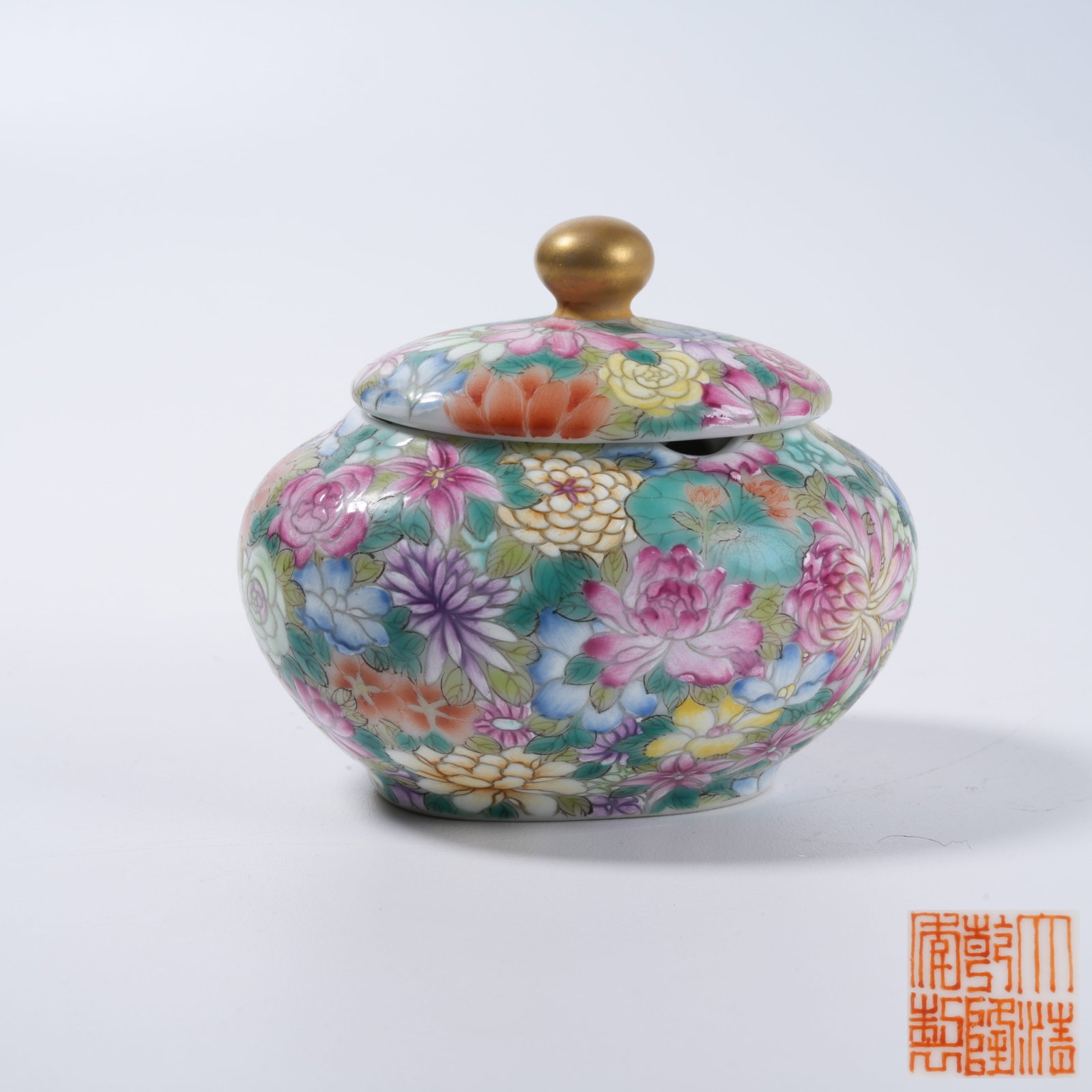 A ENAMEL COVERED JAR WITH FLORAL PATTERN: Enamel Covered Jar with Floral Pattern