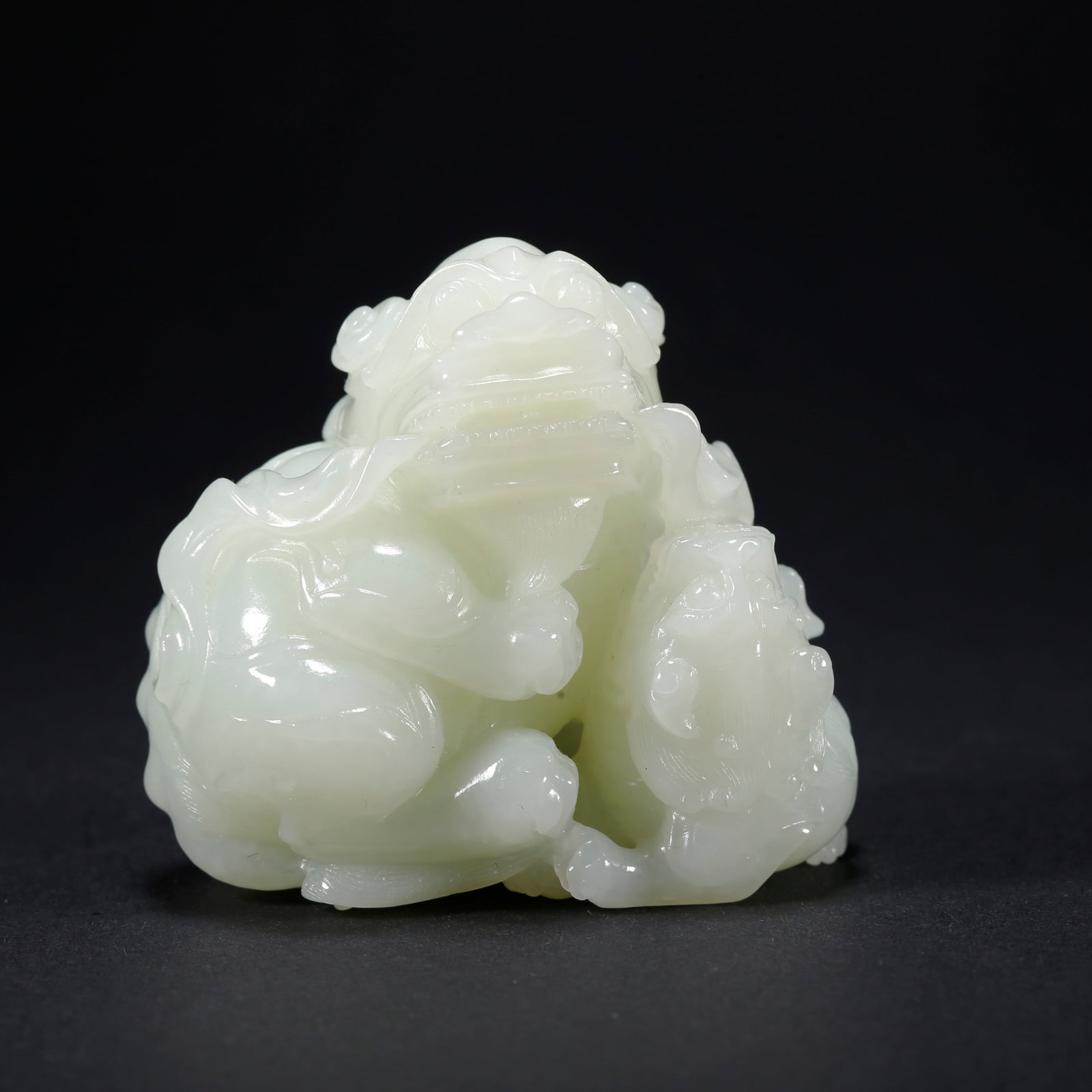 A HETIAN JADE ADULT AND CUB LION-SHAPED FIGURINE: Hetian Jade Adult and Cub Lion-Shaped Figurine
