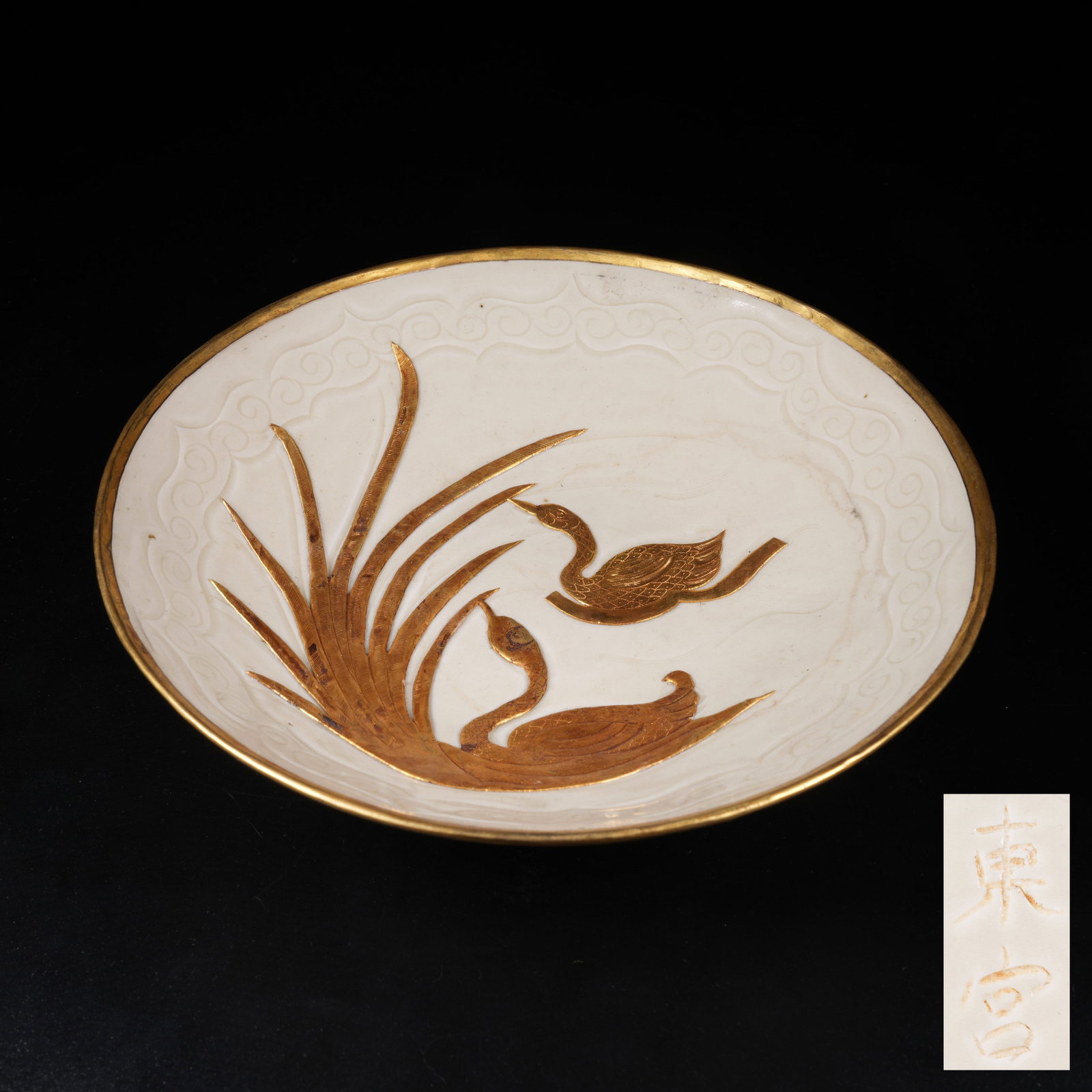 A DING KILN PLATE WITH FLOWER AND BIRD PATTERN: Ding Kiln Plate with Flower and Bird Pattern