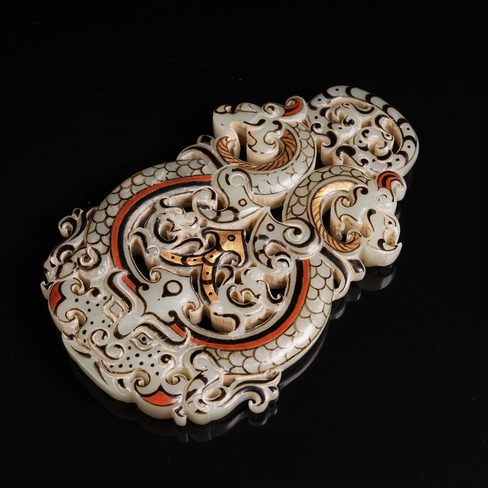 A ANCIENT JADE PAINTED AND GILDED DOUBLE DRAGON PENDANT: Ancient Jade Painted and Gilded Double Dragon Pendant