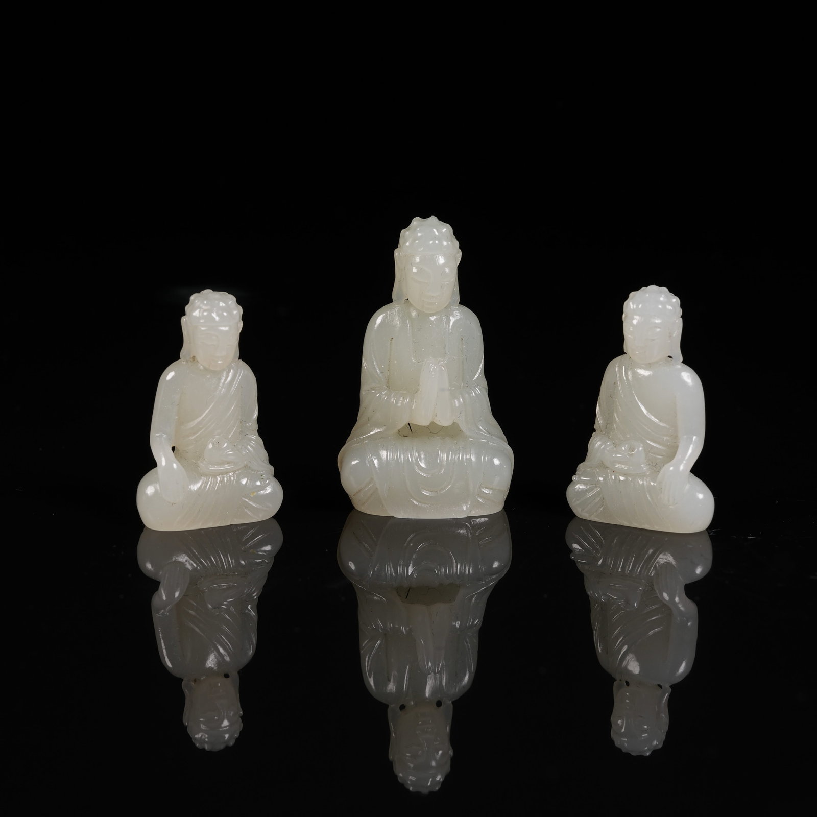A SET OF HETIAN JADE THREE AGES BUDDHAS (1 of 10)