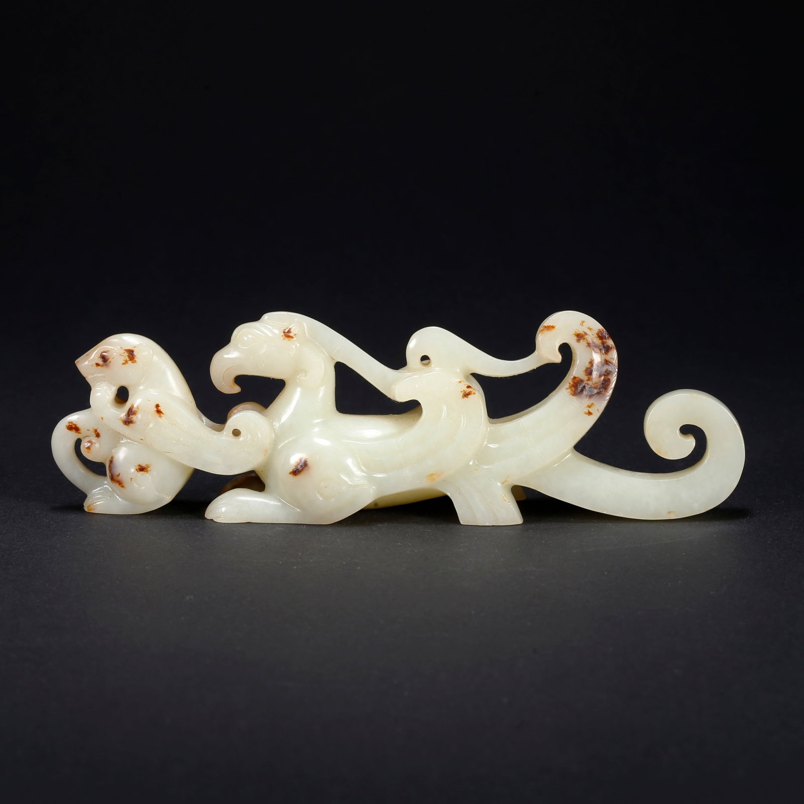 A HETIAN JADE PHOENIX-SHAPED FIGURINE: Hetian Jade Phoenix-Shaped Figurine