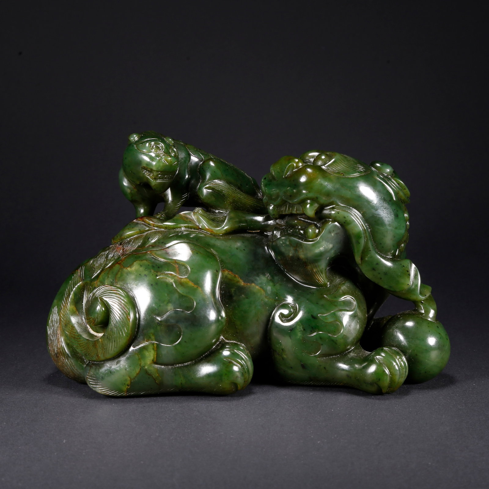 A HETIAN BIYU ADULT AND CUB LION-SHAPED FIGURINE (1 of 9)