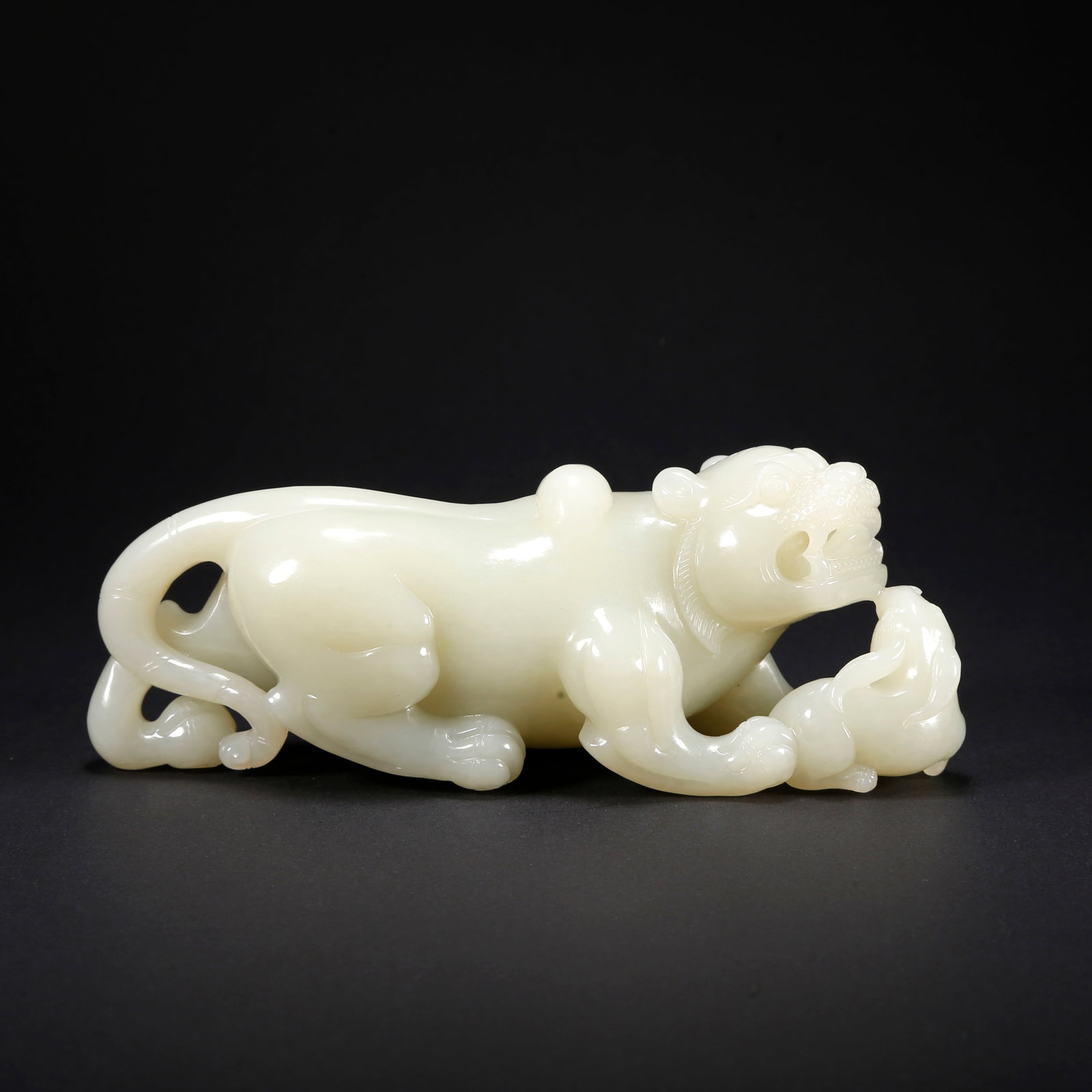 A HETIAN JADE BEAST-SHAPED FIGURINE: Hetian Jade Beast-Shaped Figurine