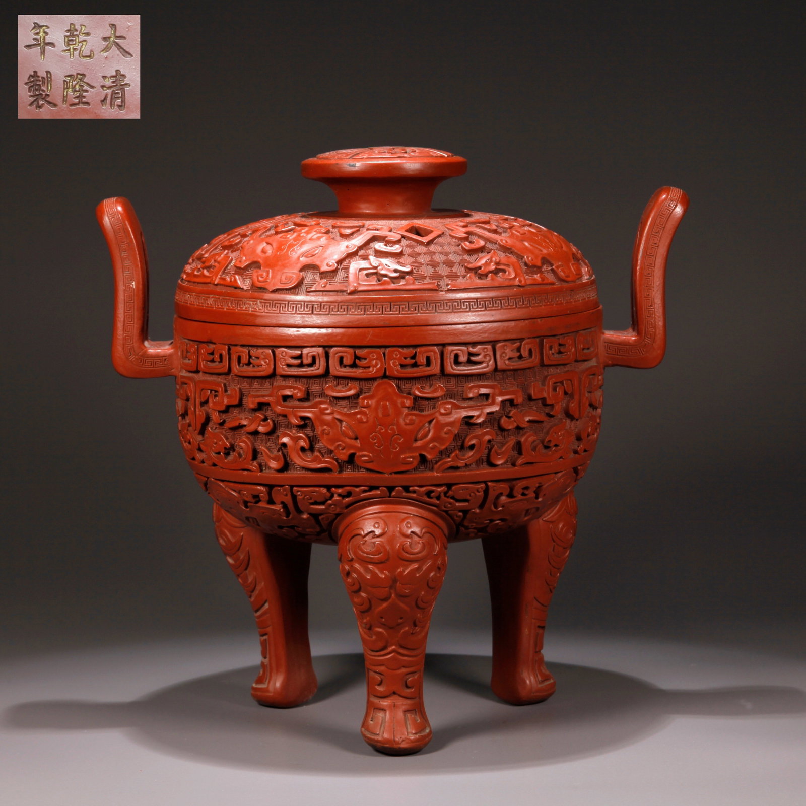 A CARVED RED LACQUER CENSER WITH BEAST FACE AND UPRIGHT EARS (1 of 10)