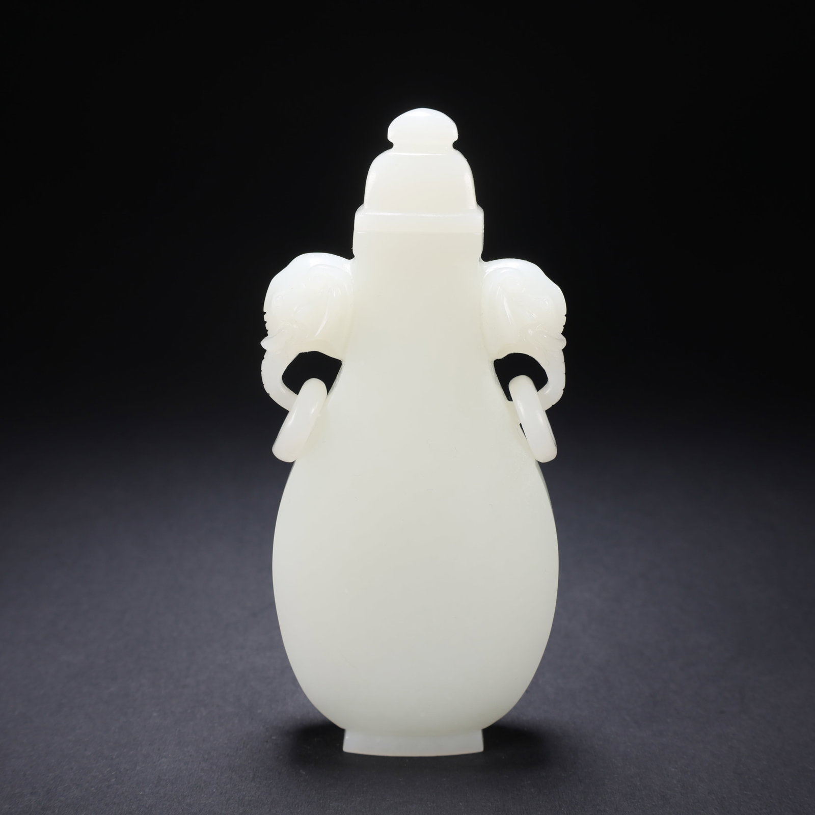 A HETIAN JADE DOUBLE-ELEPHANT-HANDLED VASE (1 of 9)