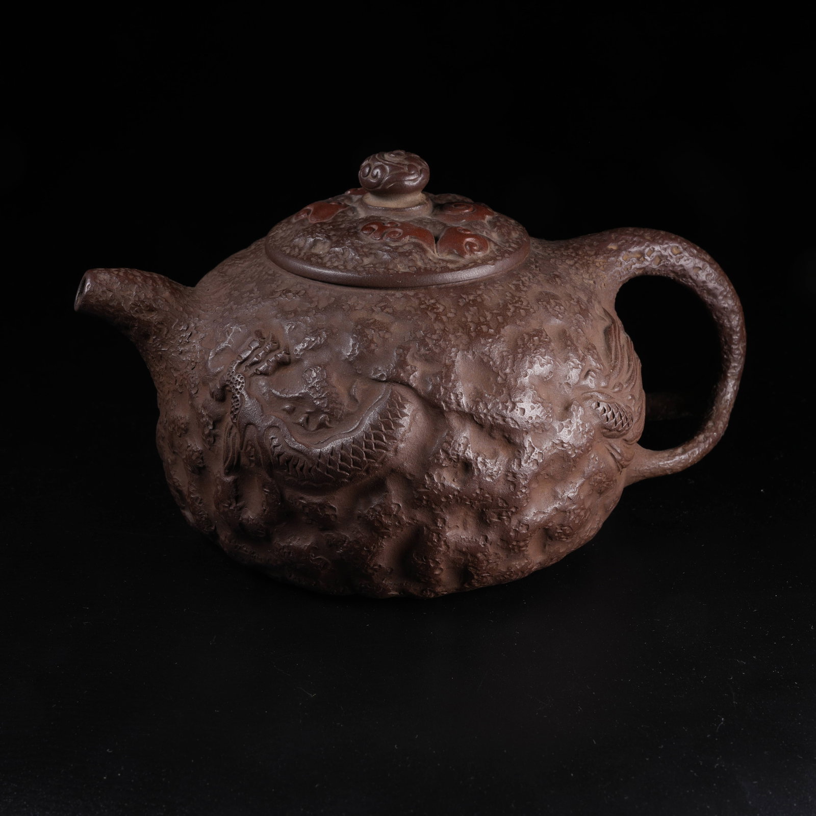 A YIXING ZISHA EWER WITH CLOUD AND DRAGON PATTERN: Yixing Zisha Ewer with Cloud and Dragon Pattern