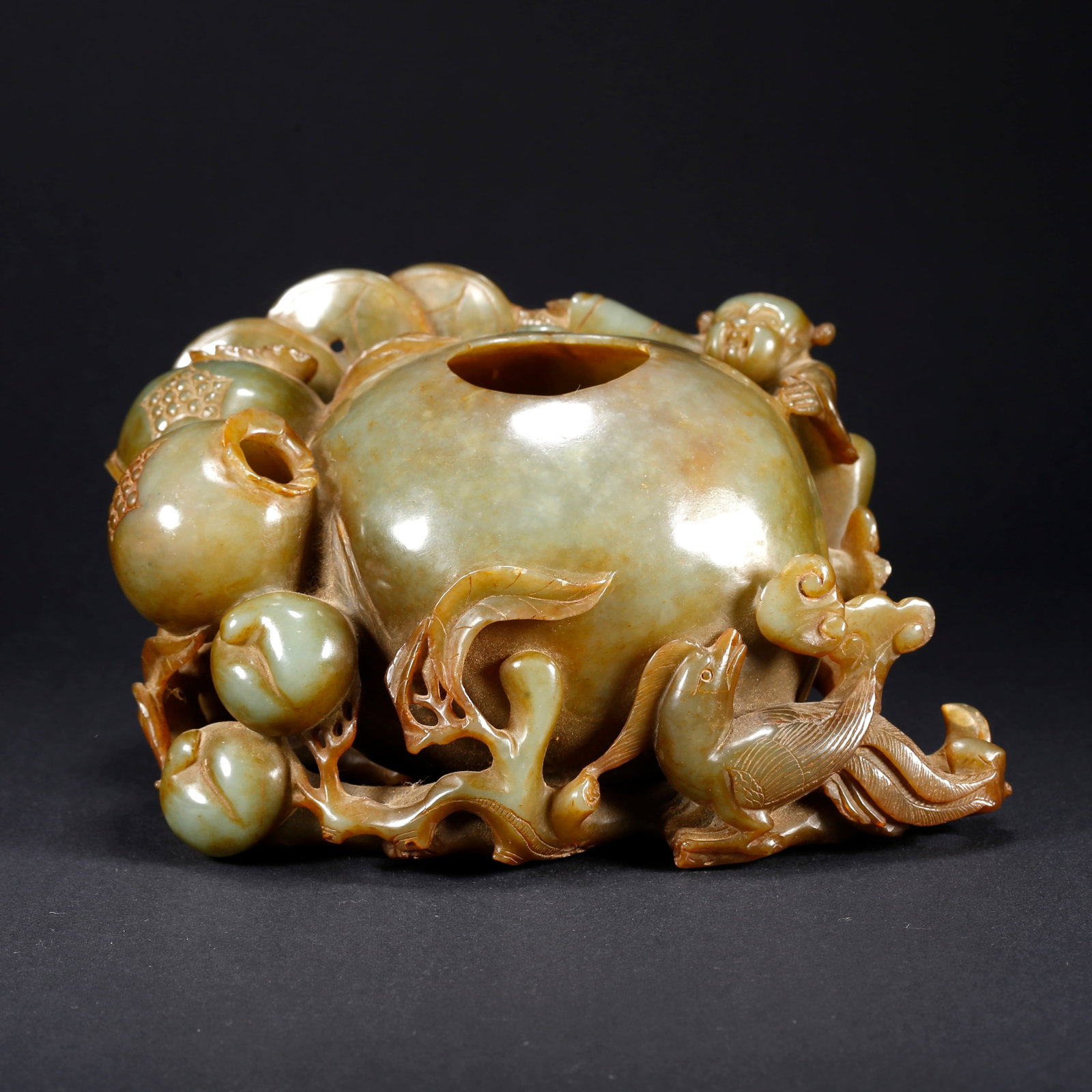 A HETIAN JADE WASHER WITH CHILD OFFERING LONGEVITY MOTIF: Hetian Jade Washer with Child Offering Longevity Motif