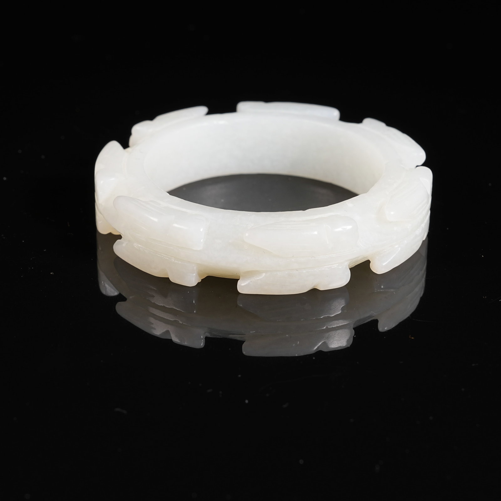 A HETIAN JADE RING WITH CICADA PATTERN: Hetian Jade Ring with Cicada Pattern