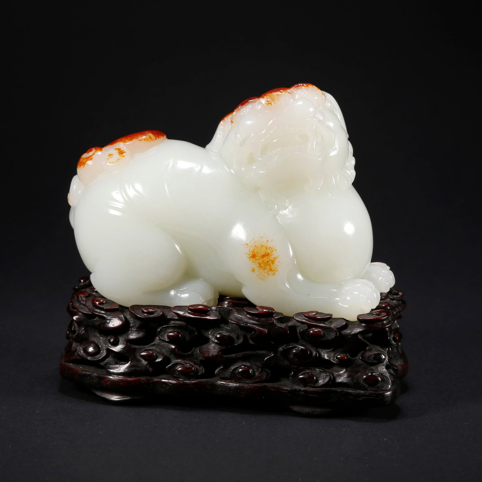 A HETIAN JADE LION-SHAPED FIGURINE: Hetian Jade Lion-Shaped Figurine