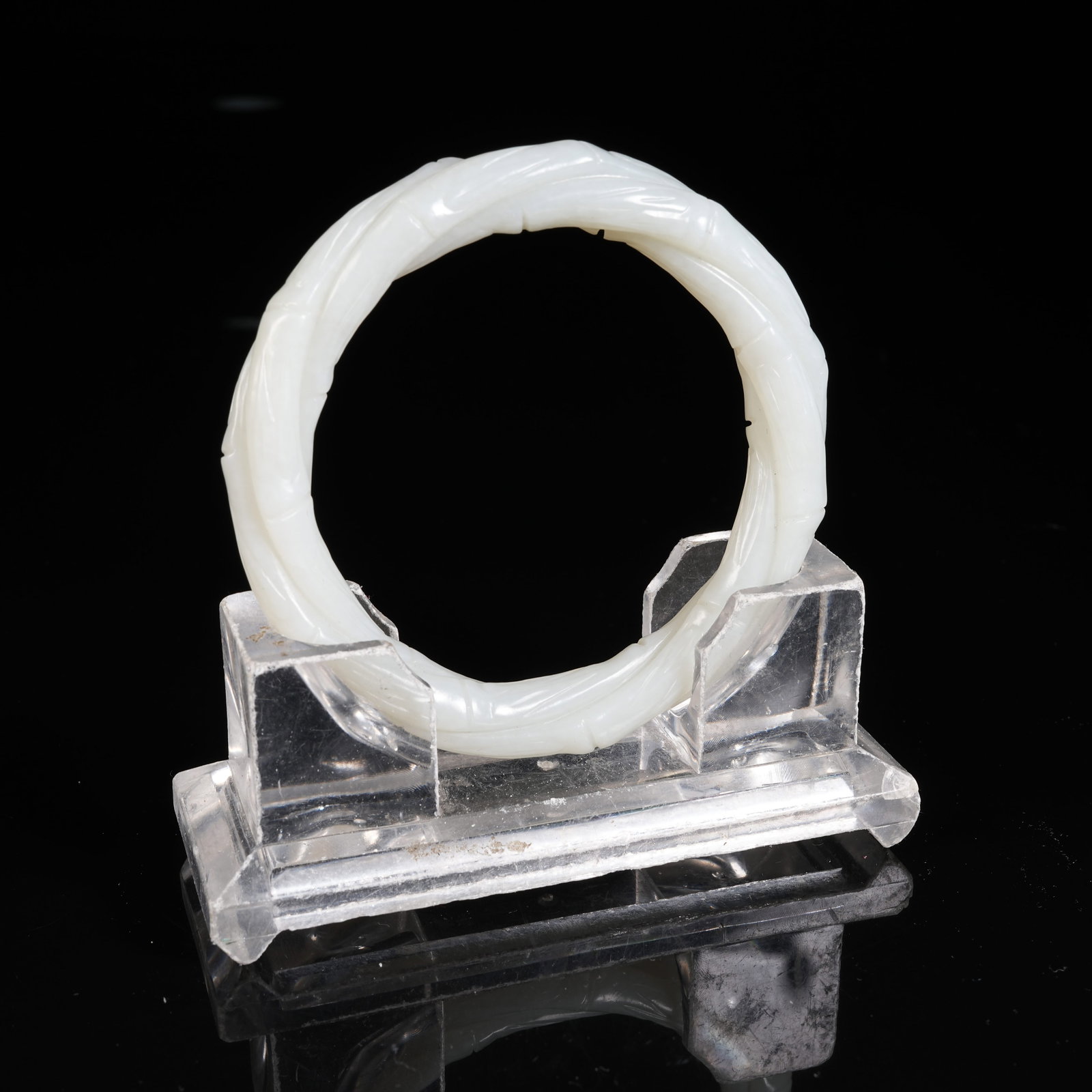 A HETIAN JADE BAMBOO-JOINT SHAPED BANGLE: Hetian Jade Bamboo-joint Shaped Bangle