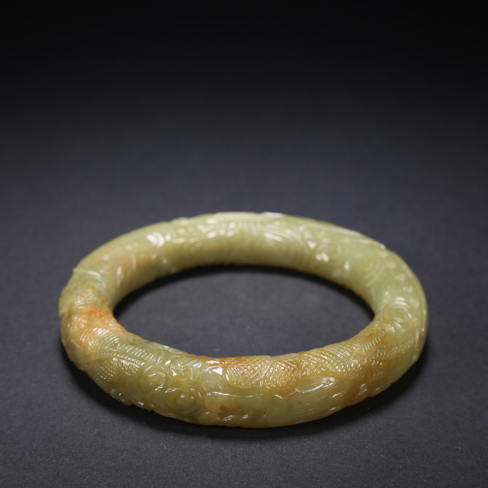 A HETIAN YELLOW JADE DRAGON-PATTERN BRACELET (1 of 9)