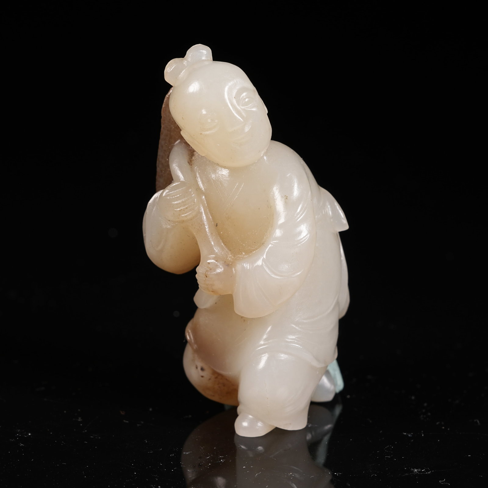 A HETIAN JADE SKILLFULLY CARVED LOTUS LEAF AND BOY PENDANT: Hetian Jade Skillfully Carved Lotus Leaf and Boy Pendant