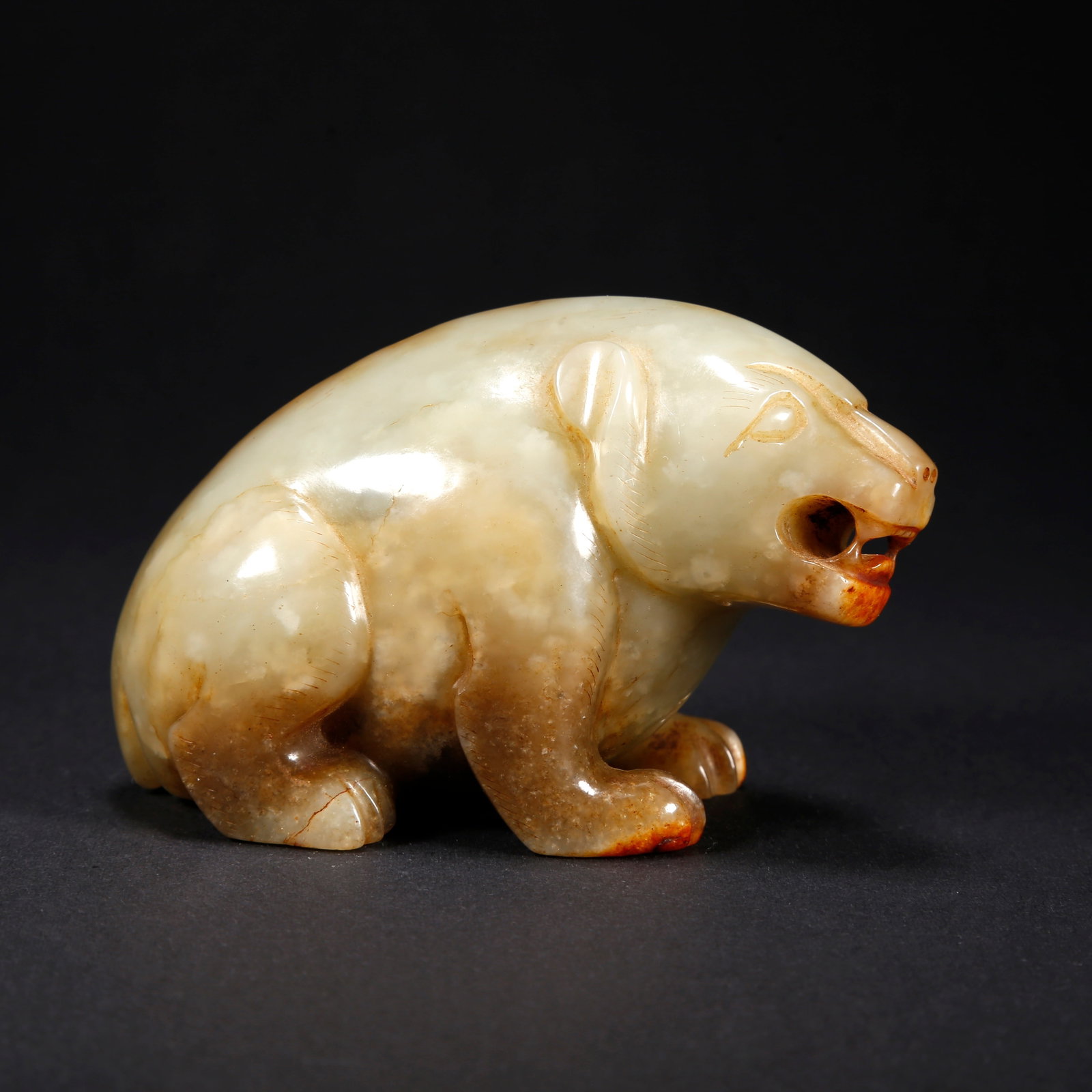 A HETIAN JADE BEAR-SHAPED FIGURINE (1 of 10)