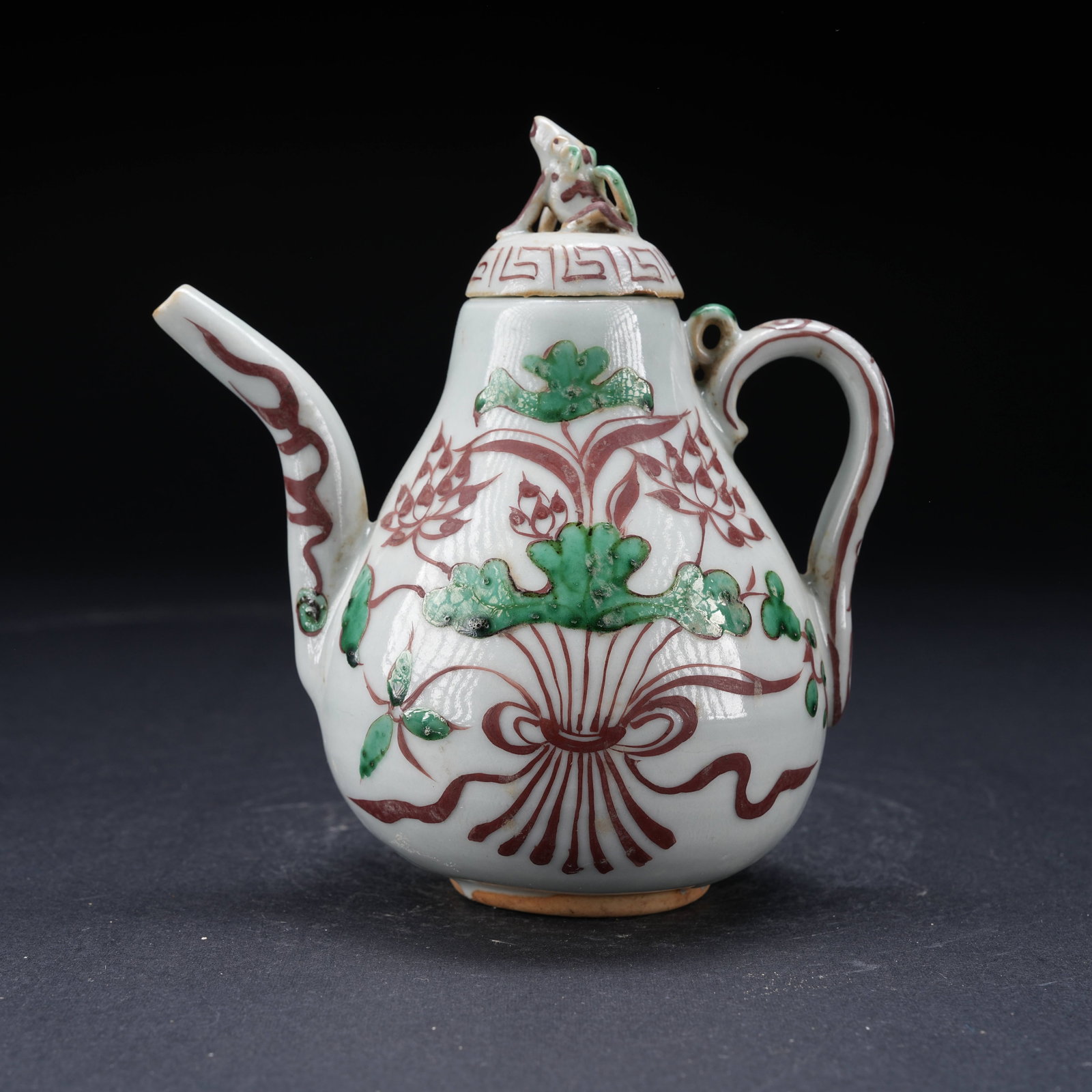 A RED AND GREEN ENAMEL EWER WITH LOTUS POND AND BEAST FINIAL: Red and Green Enamel Ewer with Lotus Pond and Beast Finial