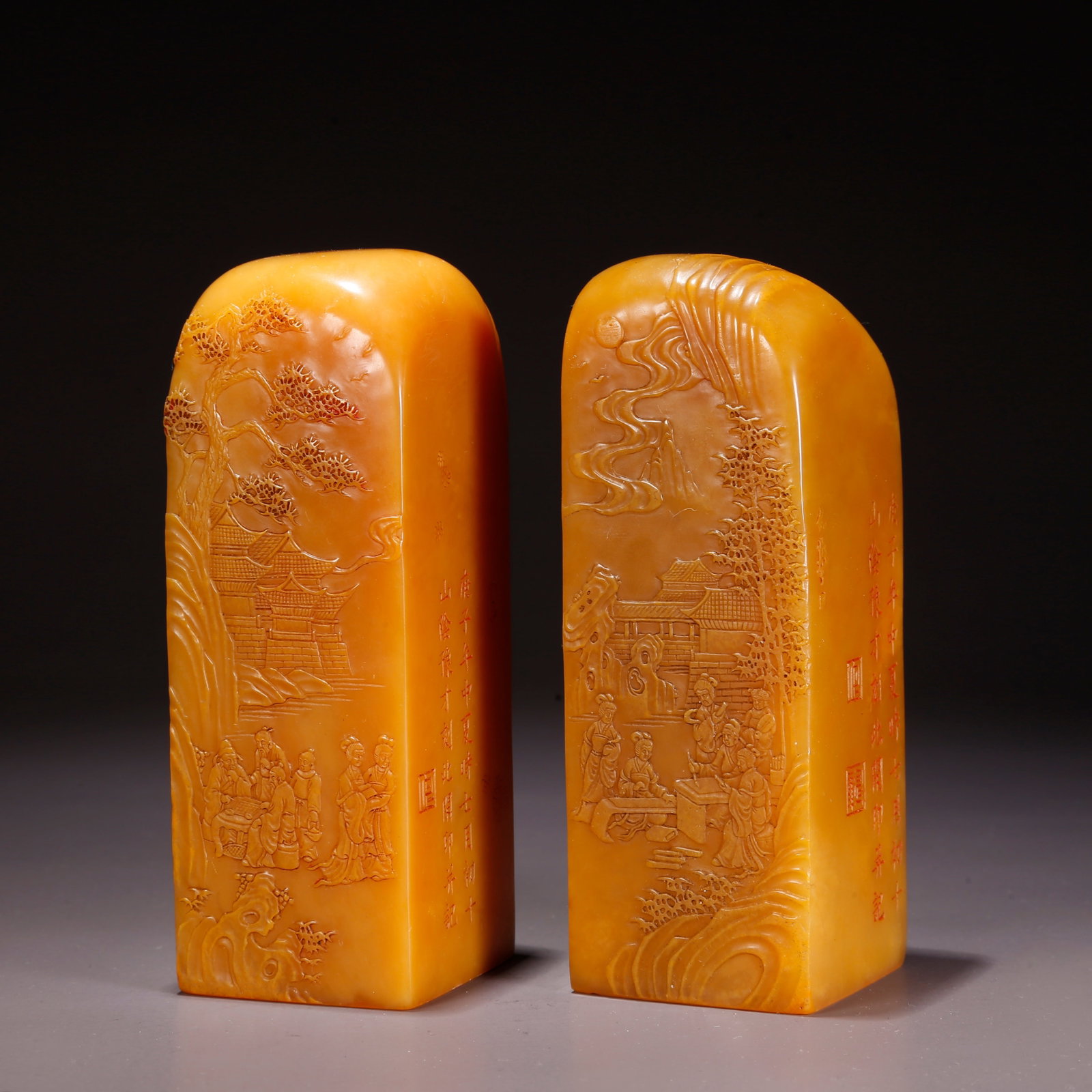 A SHOUSHAN TIANHUANG STONE SEALS WITH FIGURE NARRATIVE SCENE (PAIR): Shoushan Tianhuang Stone Seals with Figure Narrative Scene (Pair)