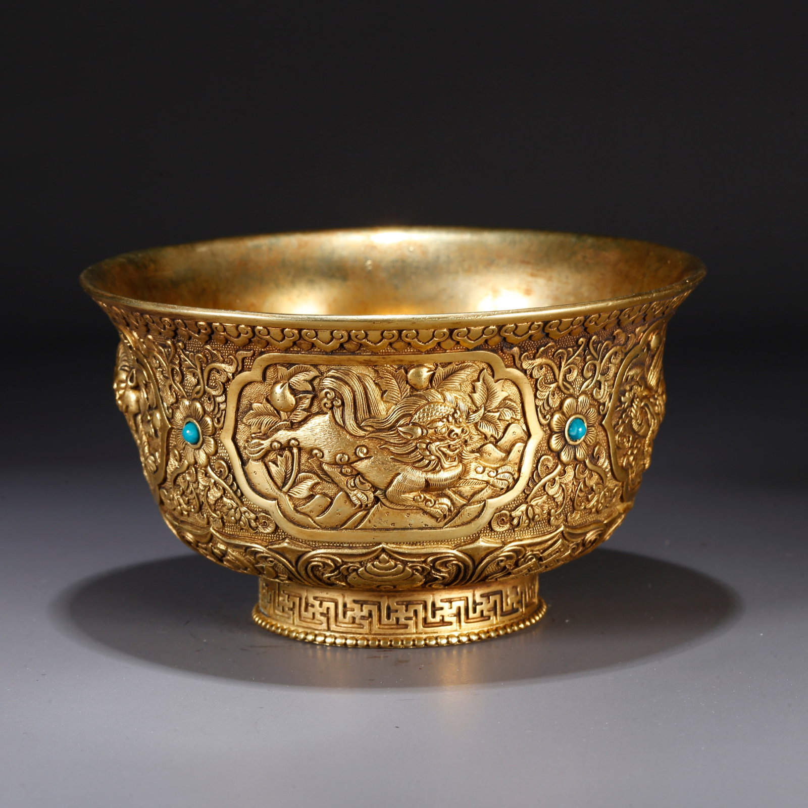 A GILT BRONZE BOWL WITH SACRED BEAST MOTIF: Gilt bronze bowl with sacred beast motif