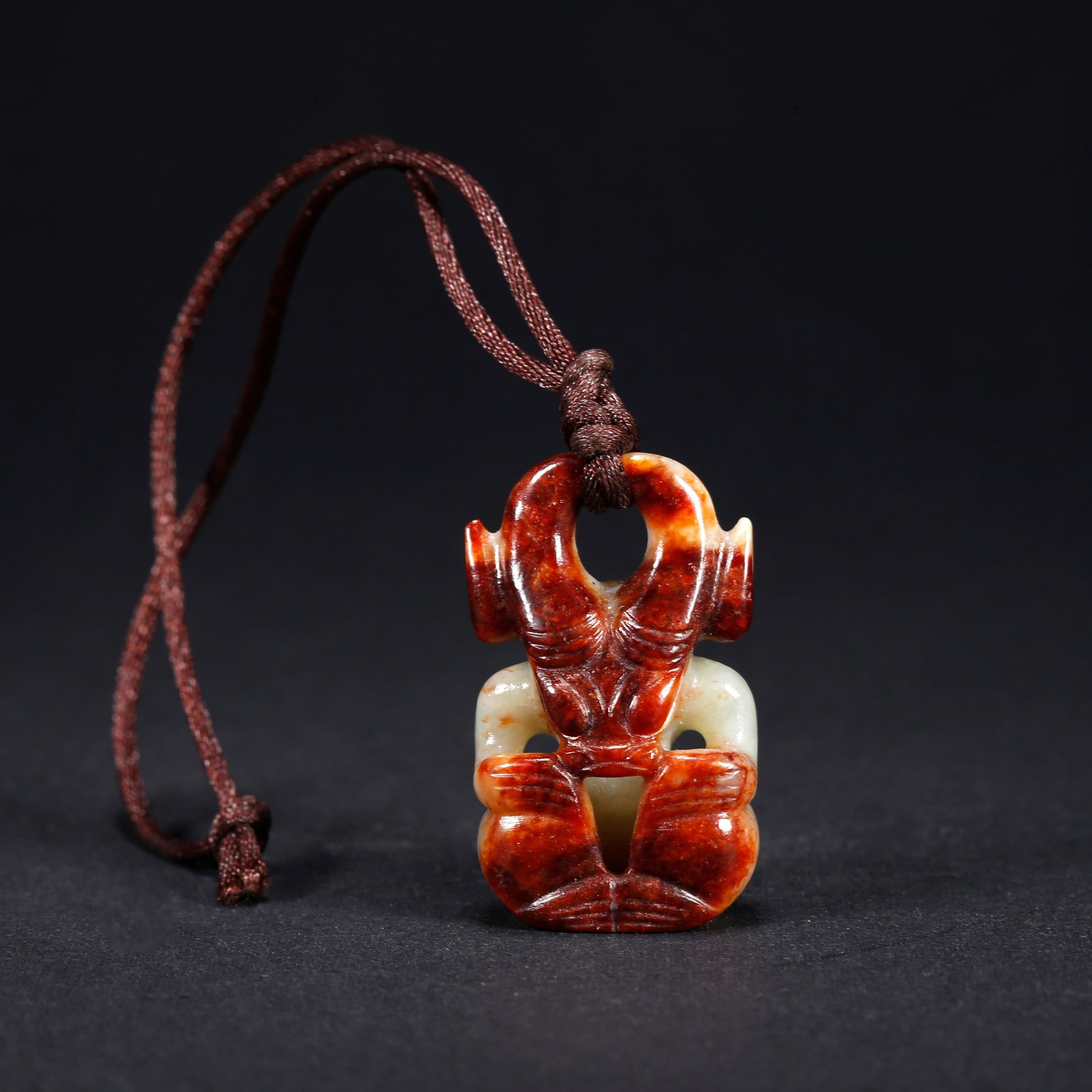 A HETIAN JADE SUN GOD PENDANT (1 of 8)