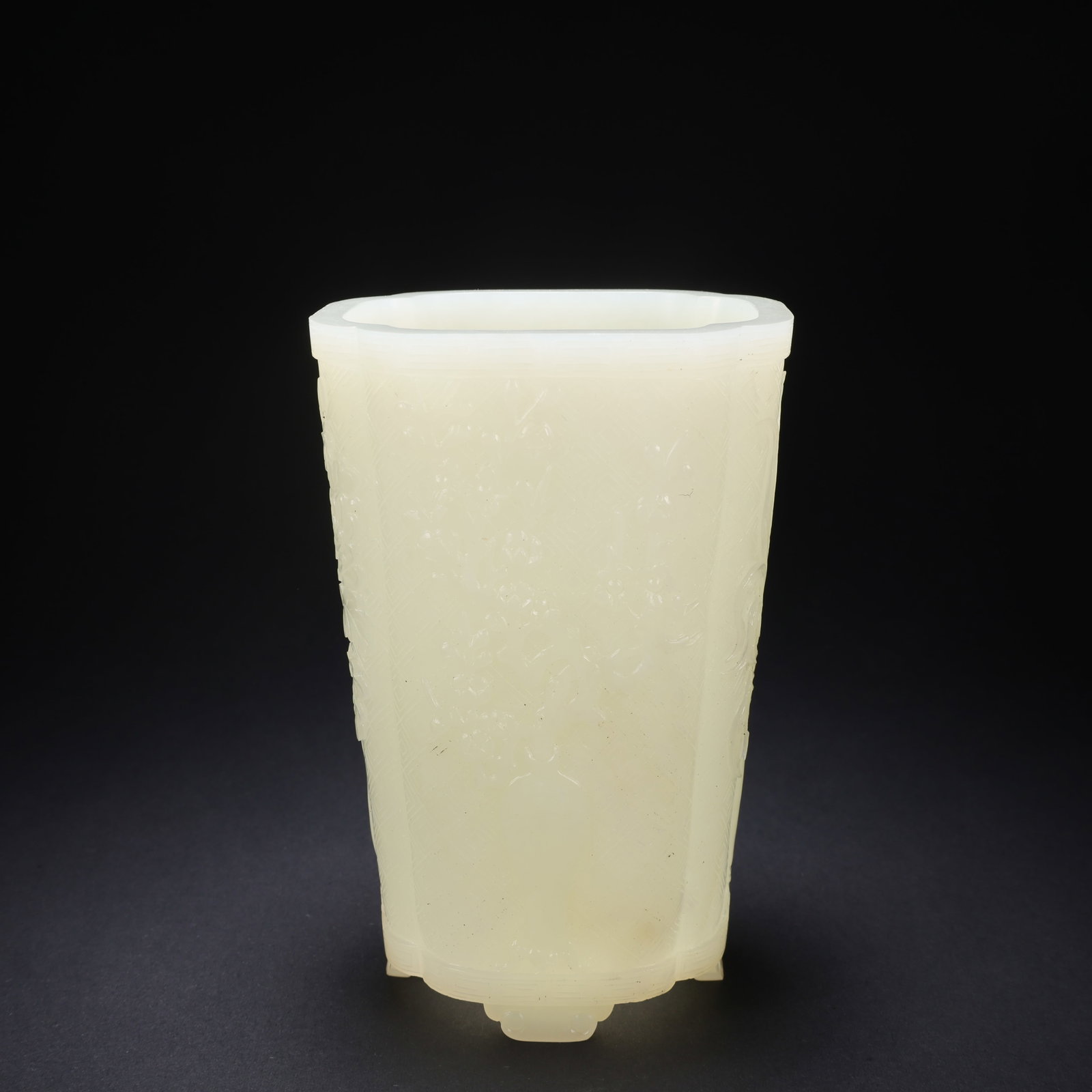 A HETIAN JADE BRUSH POT WITH PLUM, ORCHID, BAMBOO, AND CHRYSANTHEMUM MOTIFS (1 of 9)