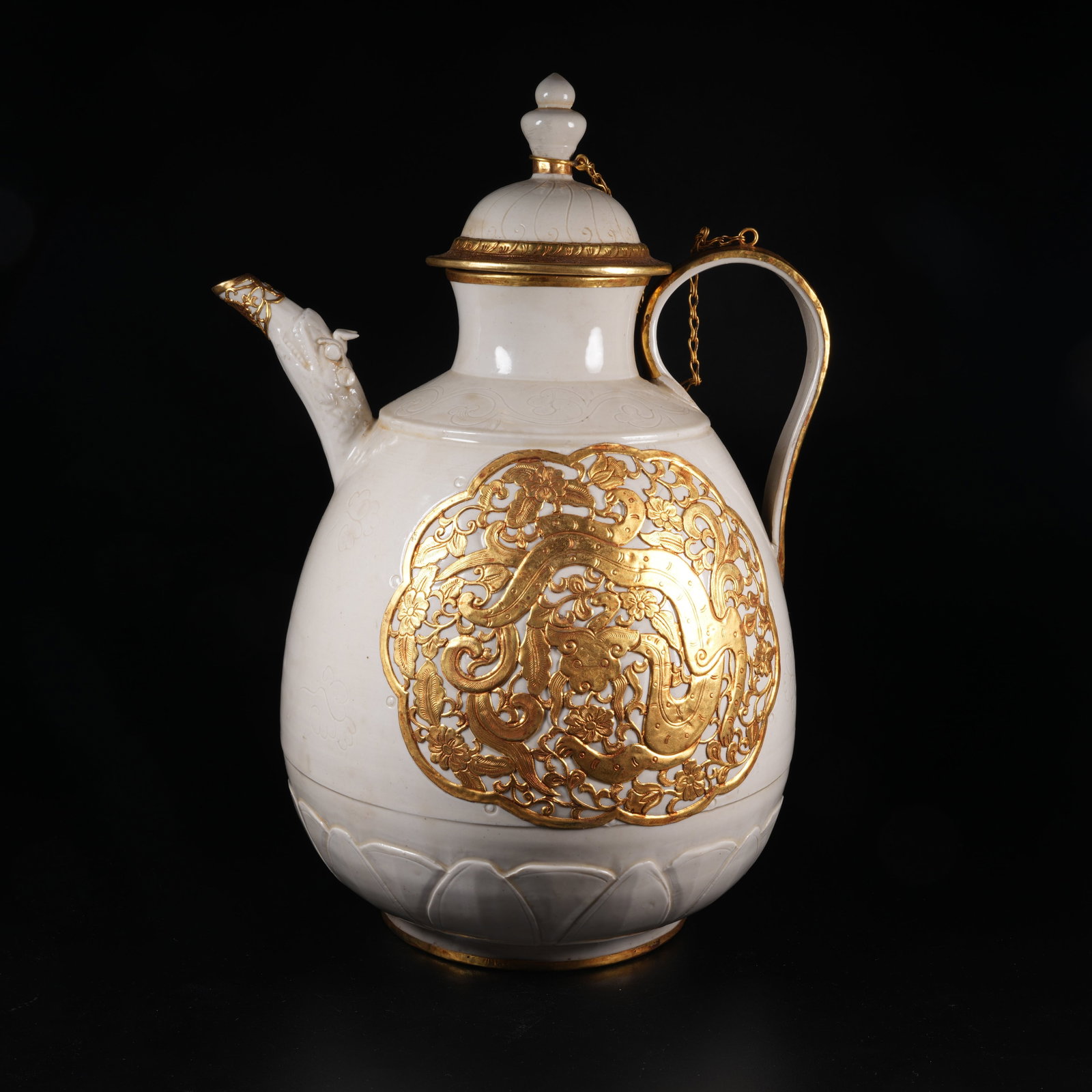 A DING KILN LARGE EWER WITH DRAGON AMIDST FLORAL SCROLLS (1 of 9)