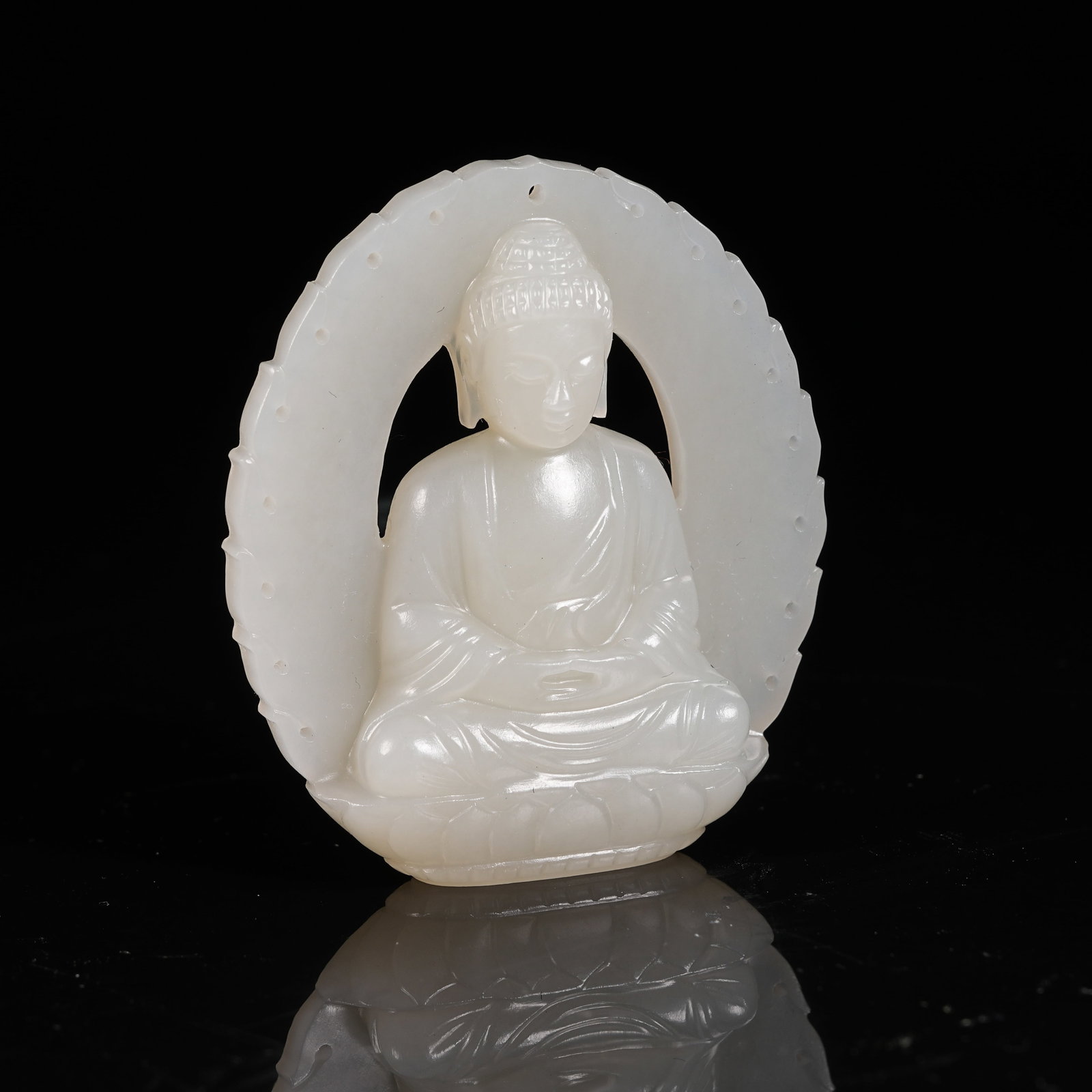 A WHITE HETIAN JADE SAKYAMUNI PENDANT: White Hetian Jade Sakyamuni Pendant