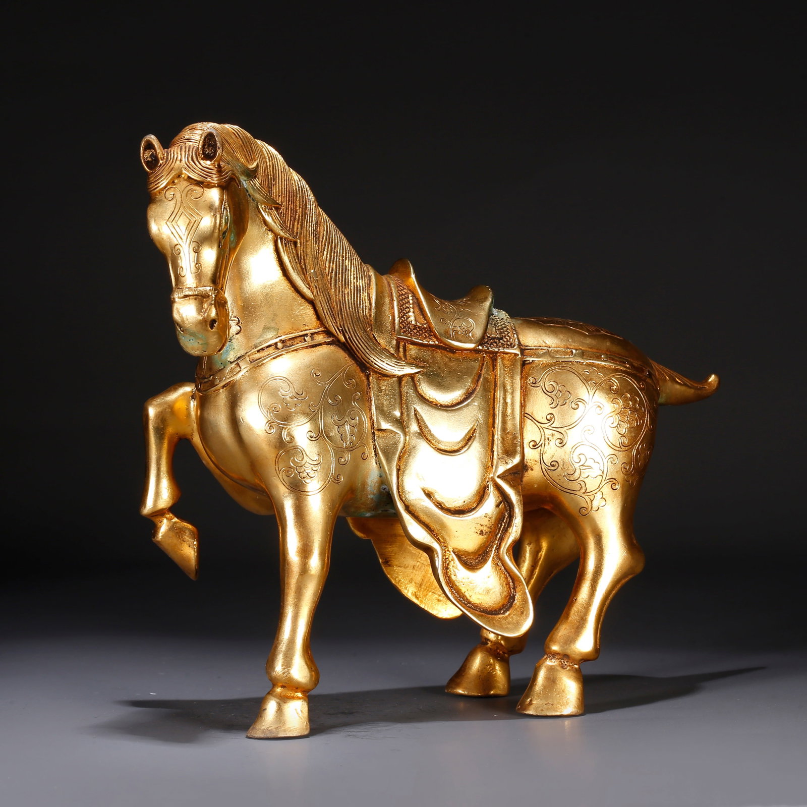 A GILT BRONZE GALLOPING HORSE-SHAPED ORNAMENT (1 of 9)
