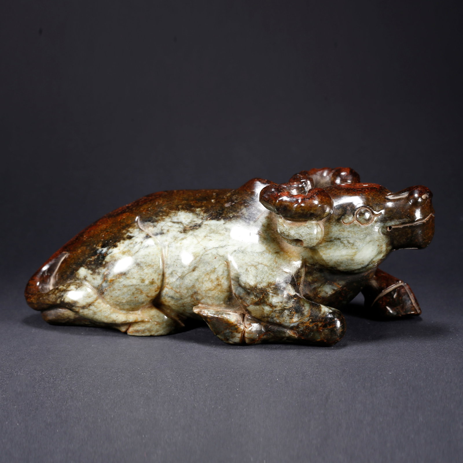 A HETIAN JADE OX-SHAPED FIGURINE: Hetian Jade Ox-Shaped Figurine