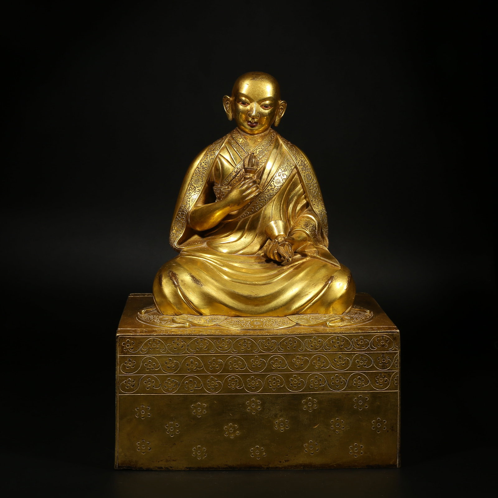 A GILT-BRONZE STATUE OF A GURU IN ZANABAZAR STYLE: Gilt-Bronze Statue of a Guru in Zanabazar Style