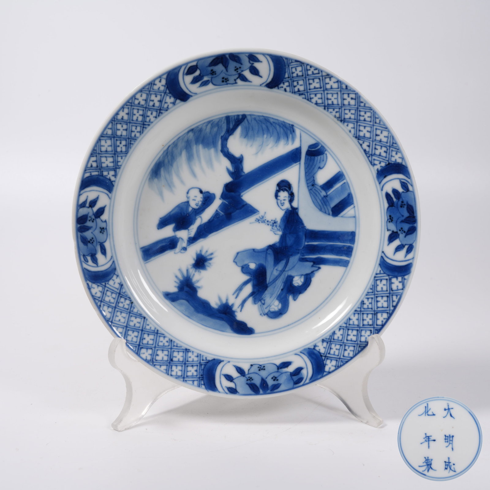 A BLUE AND WHITE FOLDED-RIM PLATE WITH COURTYARD TUTORING SCENE (1 of 7)