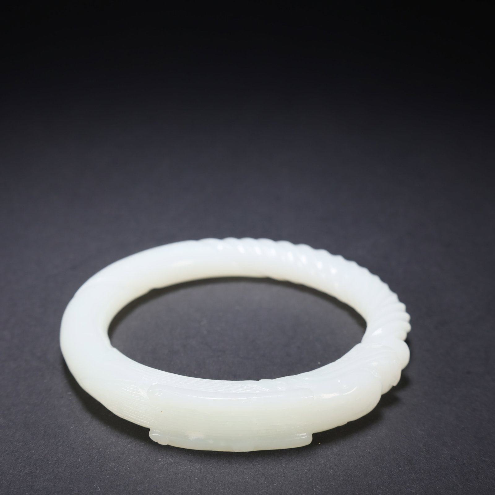 A HETIAN JADE DRAGON-PATTERN BRACELET (1 of 9)