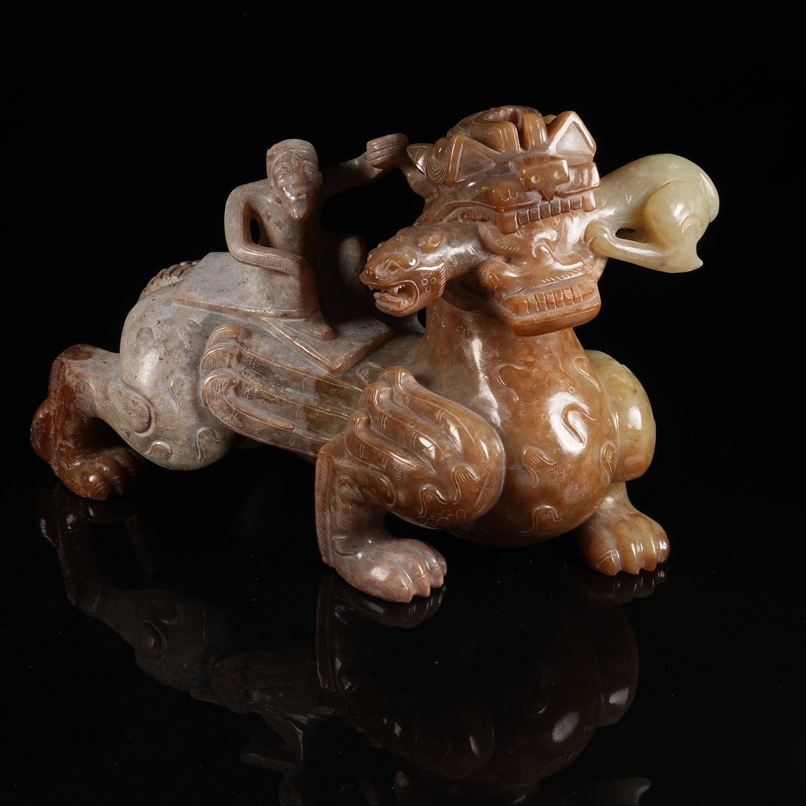 A ANCIENT JADE FEATHERED IMMORTAL RIDING BEAST ORNAMENT: Ancient Jade Feathered Immortal Riding Beast Ornament