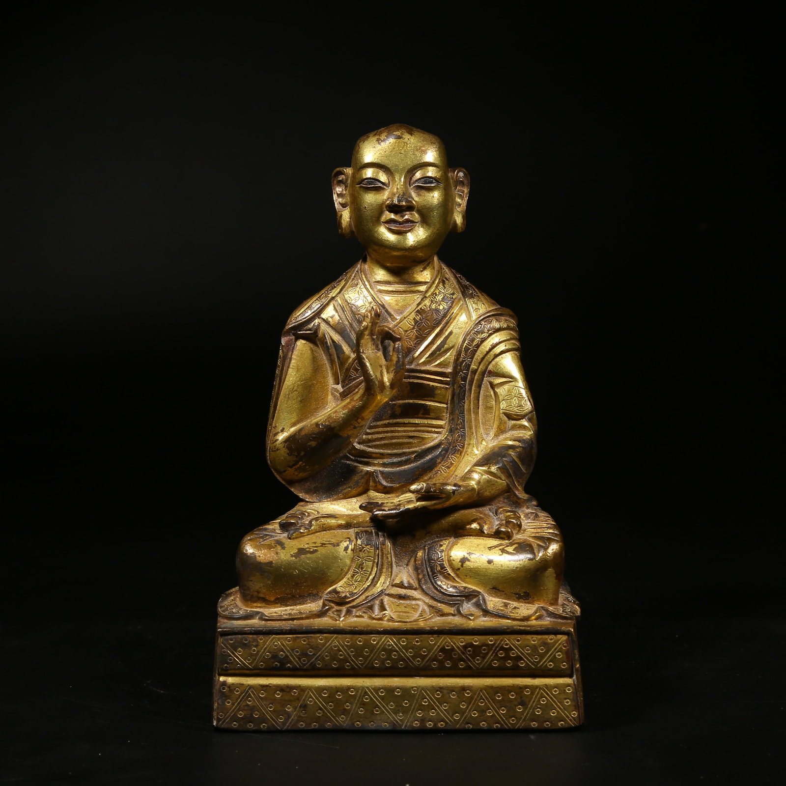 A GILDED BRONZE STATUE OF A GURU: Gilded Bronze Statue of a Guru