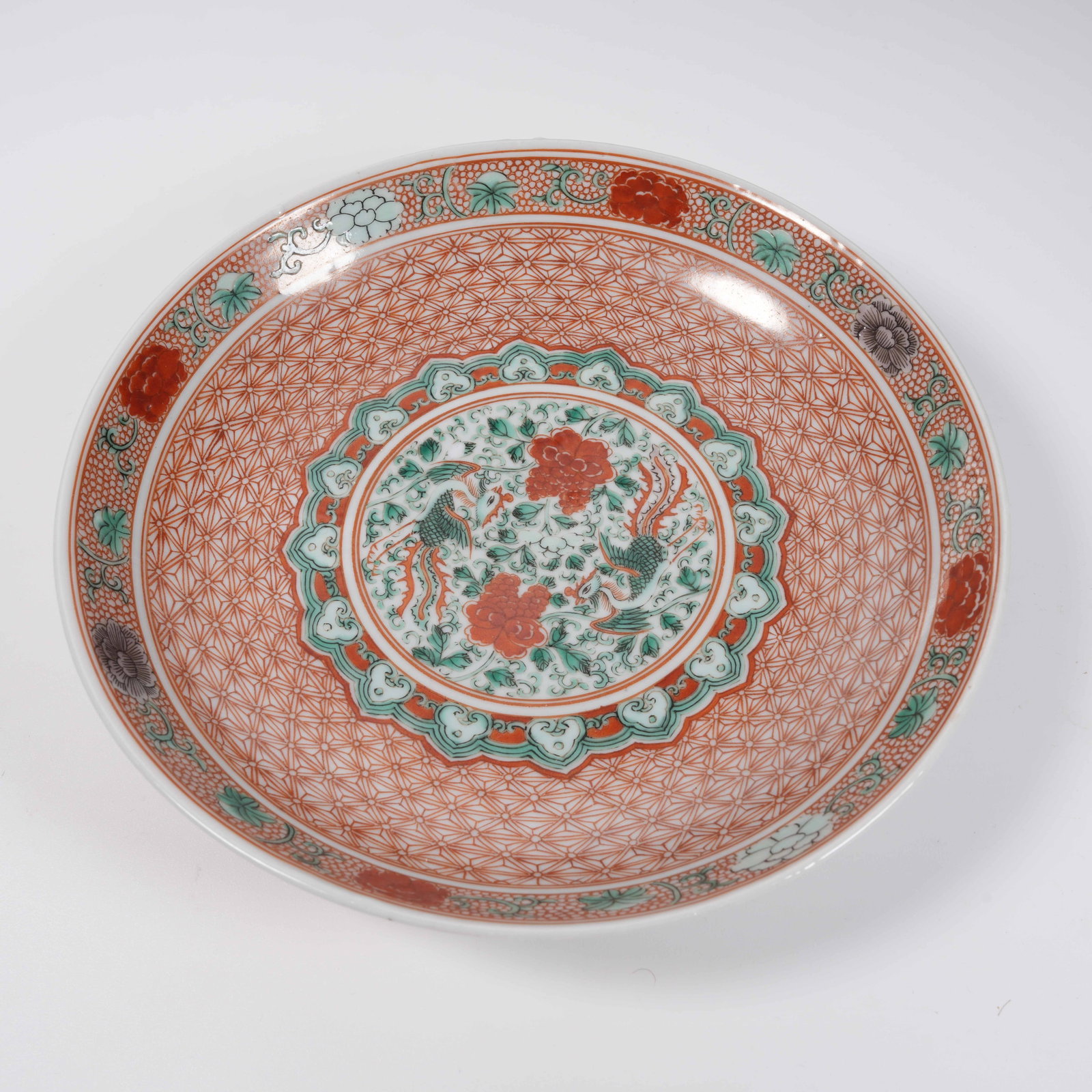 A RED AND GREEN COLOR PLATE WITH PHOENIX AMIDST FLORAL SCROLLS: Red and Green Color Plate with Phoenix Amidst Floral Scrolls