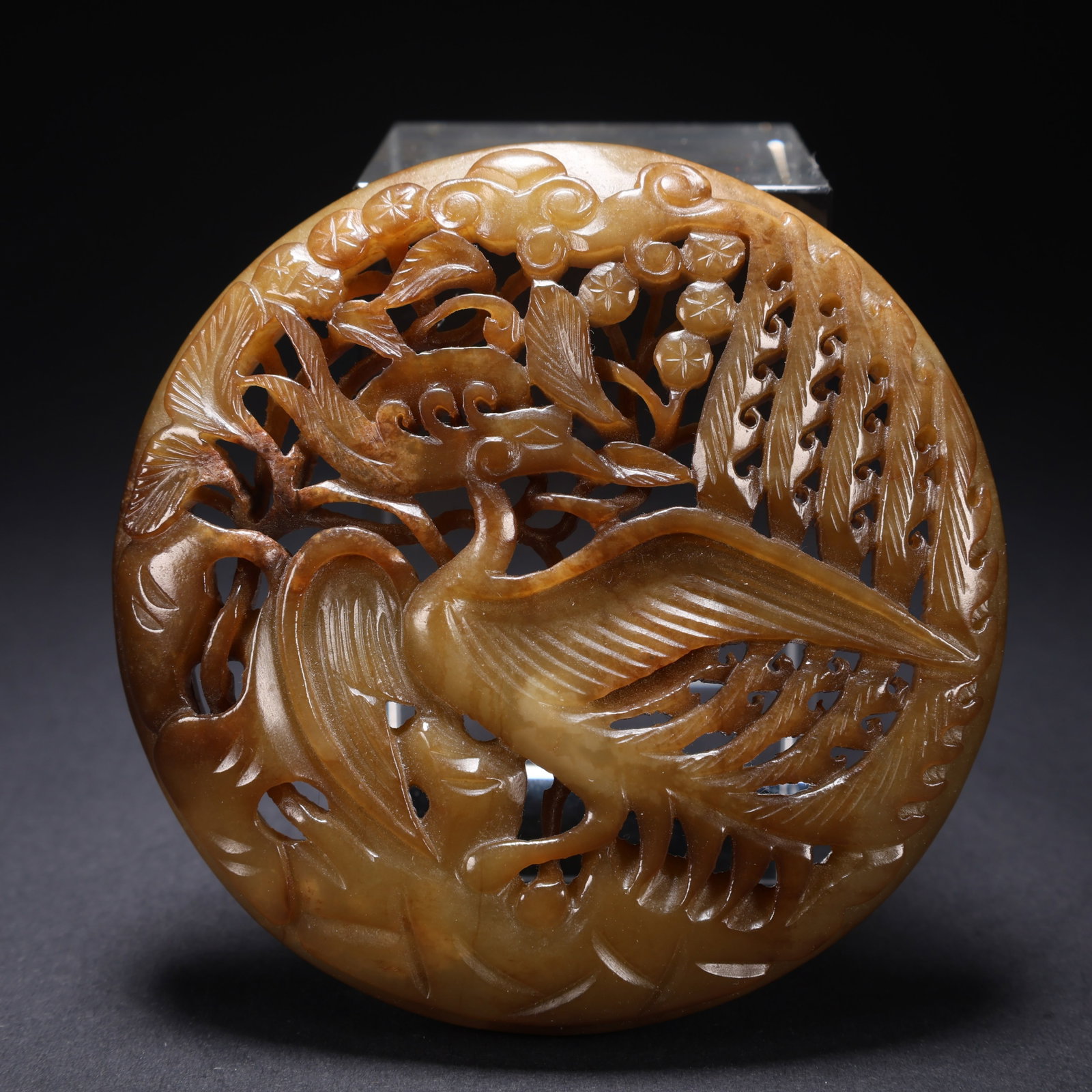 A HETIAN JADE OPENWORK CARVED PHOENIX PENDANT: Hetian Jade Openwork Carved Phoenix Pendant