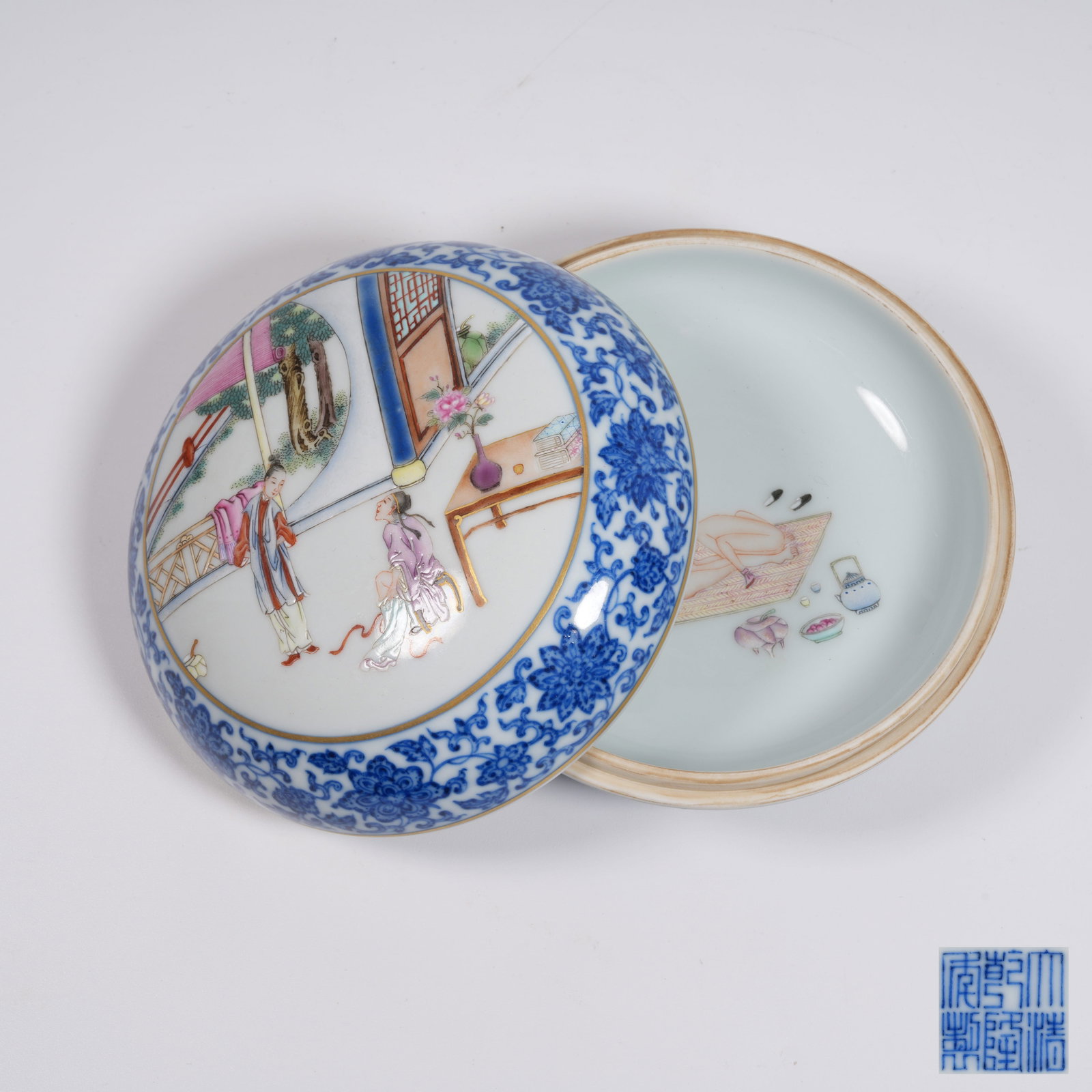 A BLUE AND WHITE LIDDED HOLDING BOX WITH PANELED FAMILLE ROSE FIGURE STORY PATTERN (1 of 9)