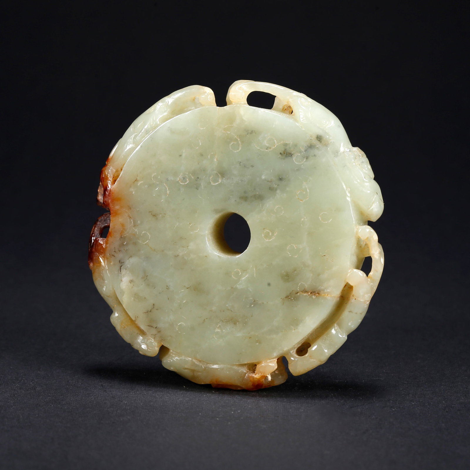 A HETIAN JADE BI DISC WITH DRAGON MOTIF: Hetian Jade Bi Disc with Dragon Motif