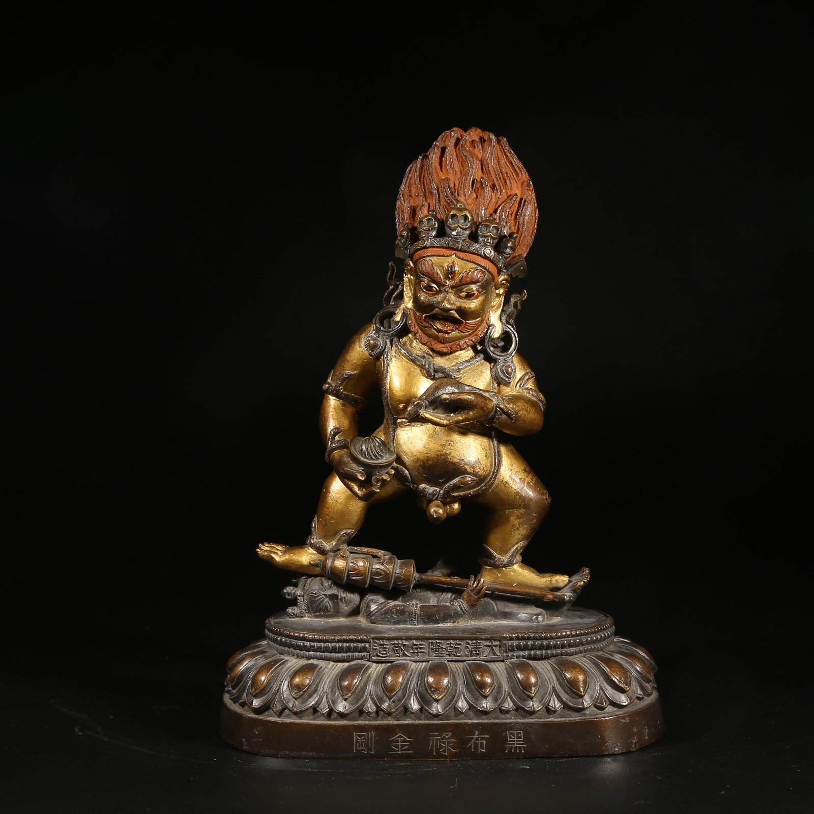 A BRONZE MUD-GILDED STATUE OF BLACK JAMBHALA (1 of 8)