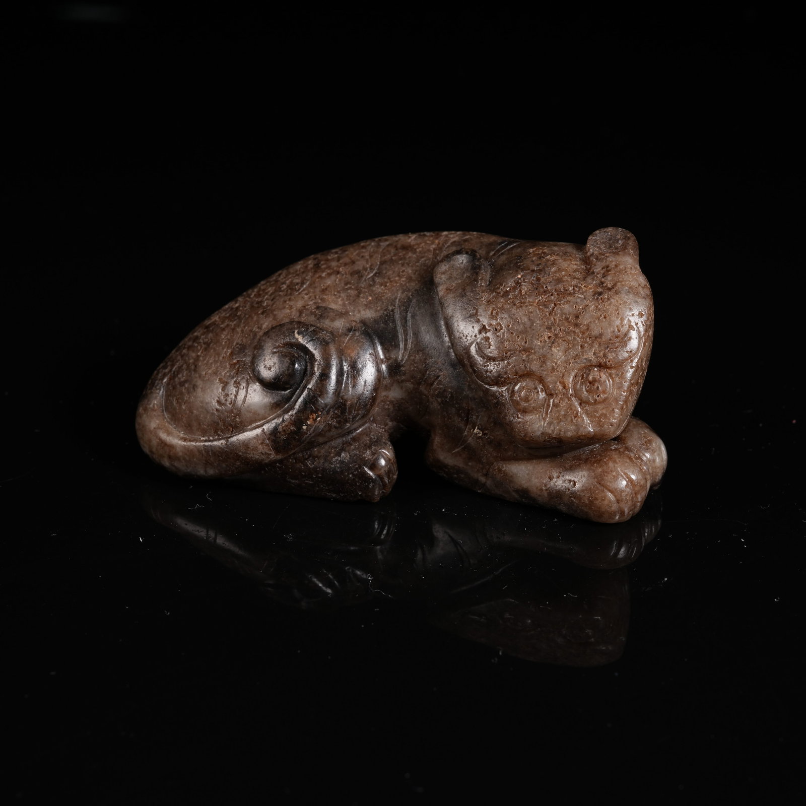 A ANCIENT JADE RECLINING BEAST ORNAMENT (1 of 8)