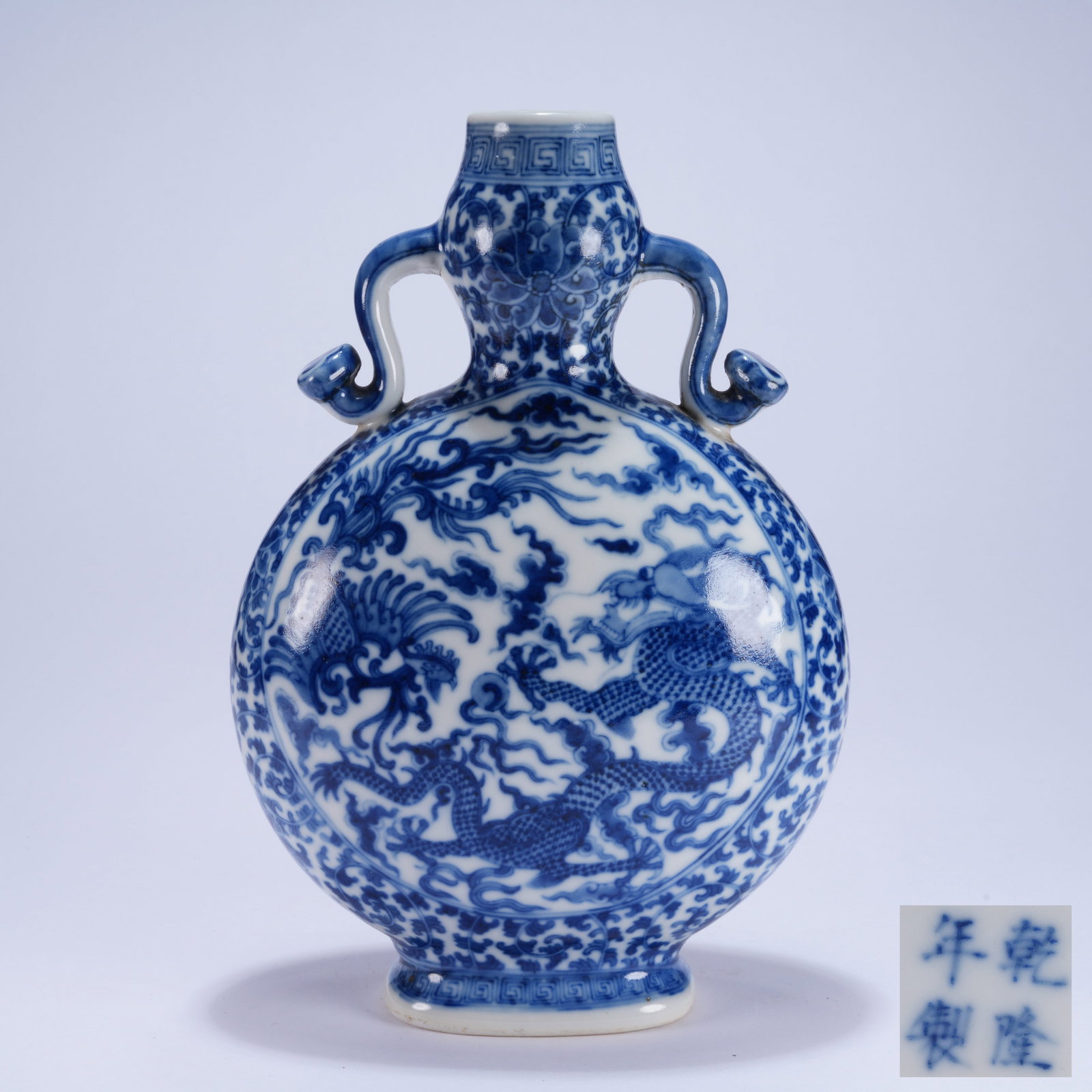 A BLUE AND WHITE FLAT VASE WITH DRAGON AND PHOENIX PATTERN AND RUYI EARS (1 of 10)