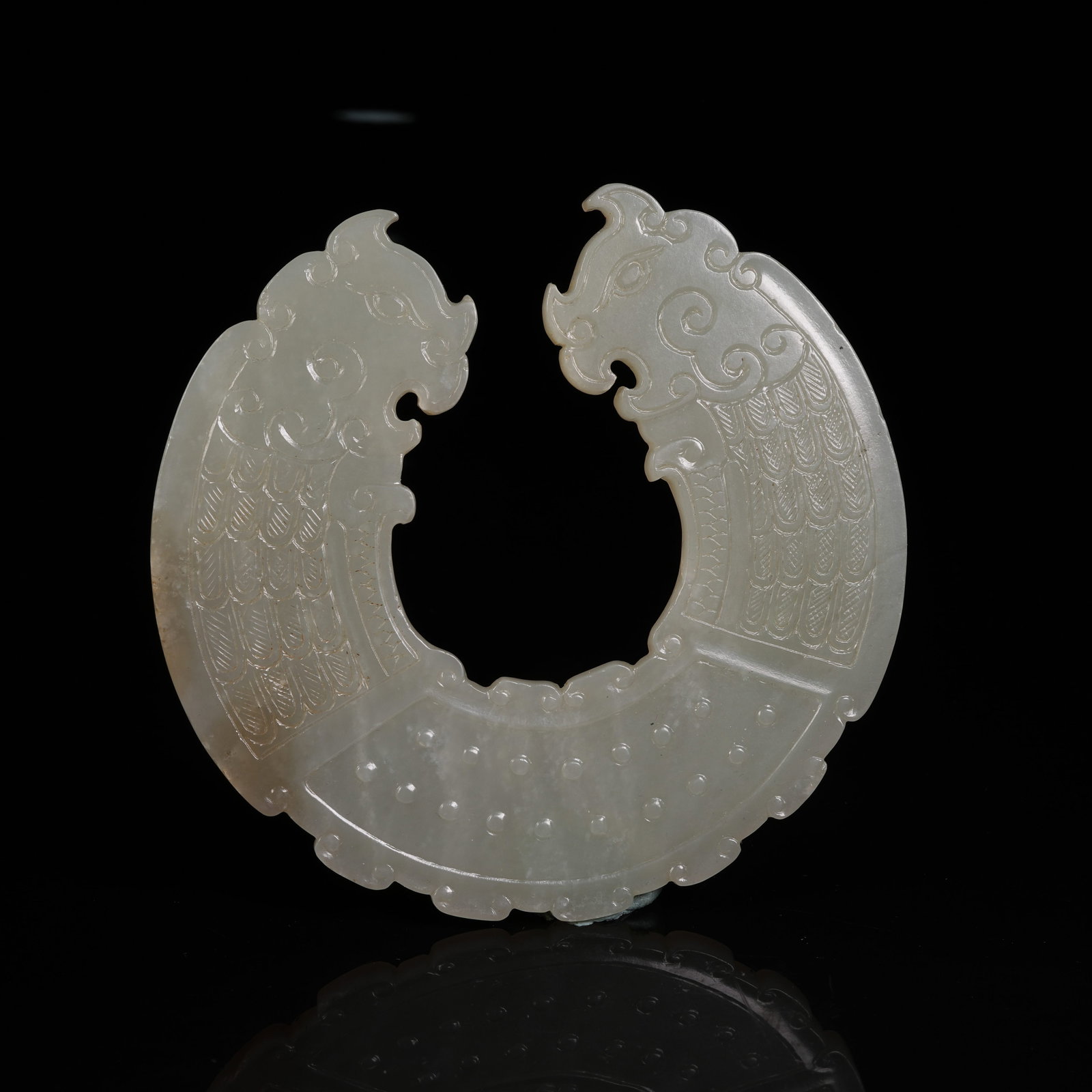 A HETIAN JADE DOUBLE PHOENIX HEAD HUANG PENDANT: Hetian Jade Double Phoenix Head Huang Pendant