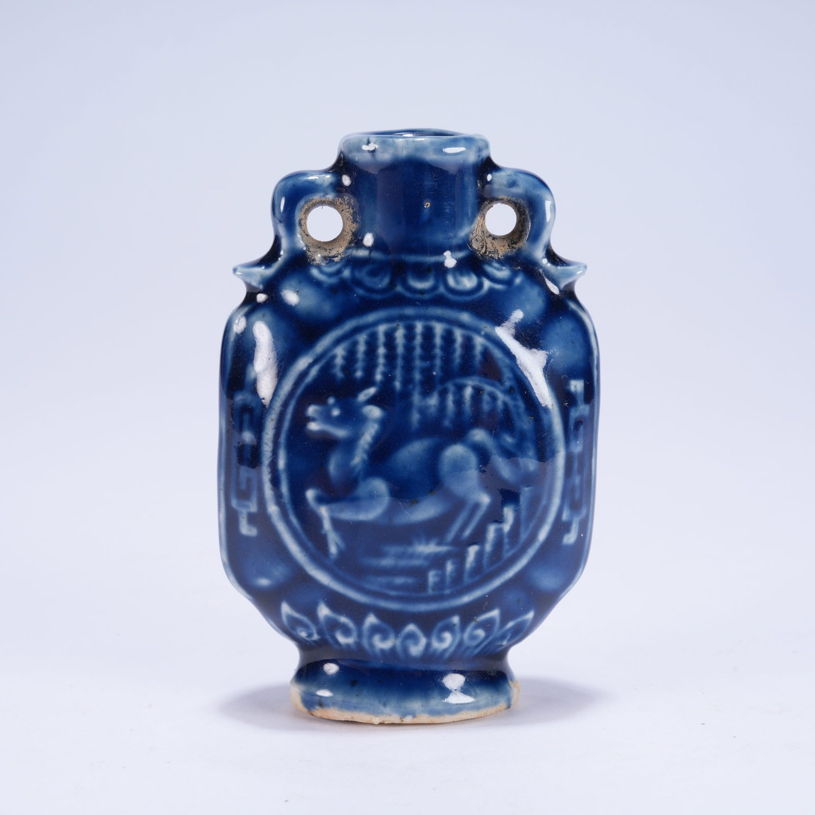 A JI BLUE GLAZED SMALL TWO-EARED VASE WITH SEA BEAST PATTERN: Ji Blue Glazed Small Two-eared Vase with Sea Beast Pattern