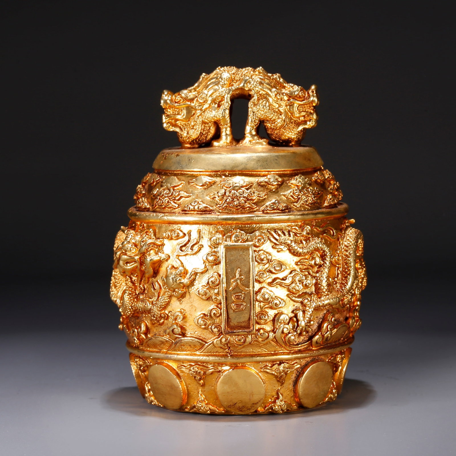 A GILT BRONZE ORNAMENT WITH DOUBLE DRAGON KNOBS (1 of 9)