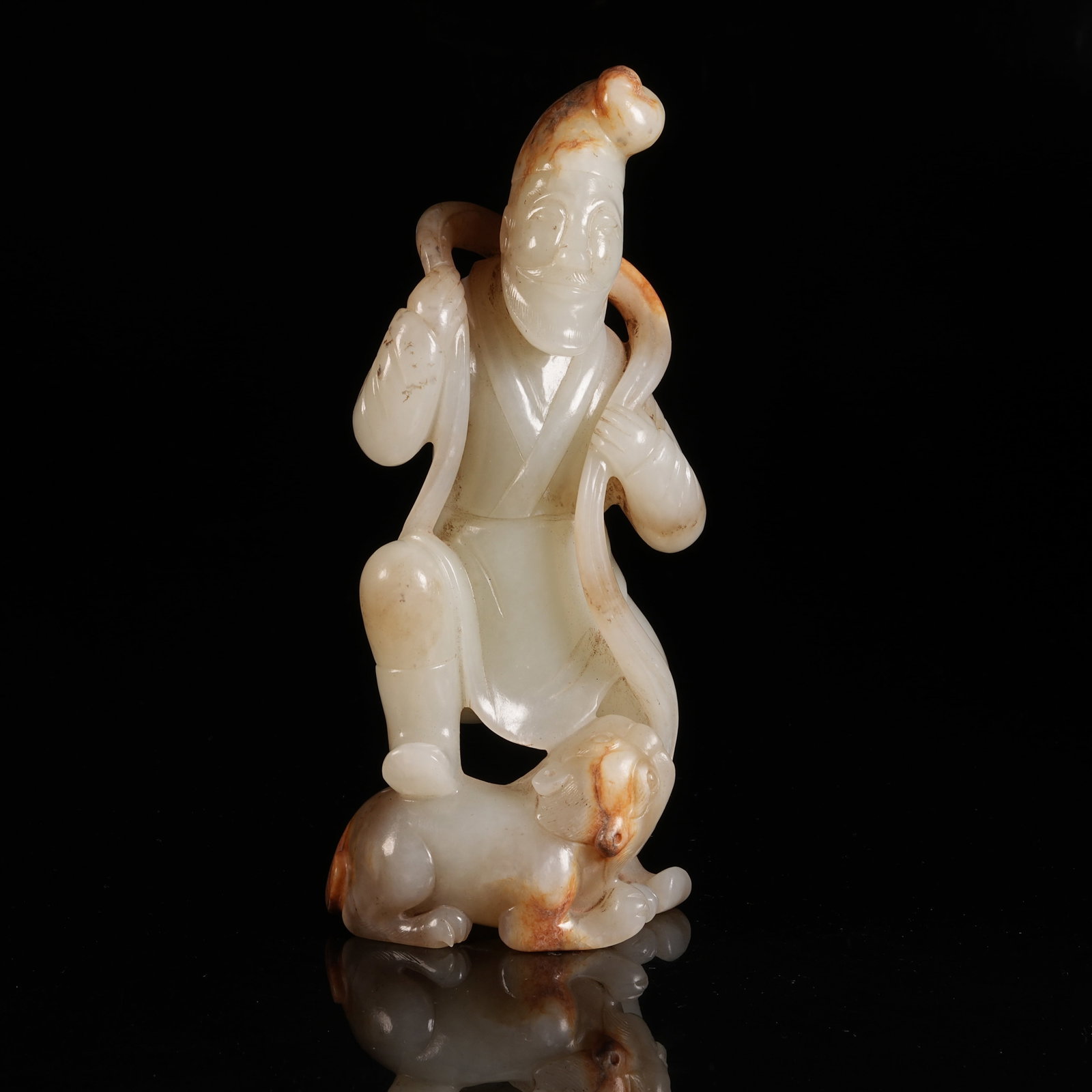 A HETIAN JADE FOREIGNER PLAYING WITH LION ORNAMENT: Hetian Jade Foreigner Playing with Lion Ornament