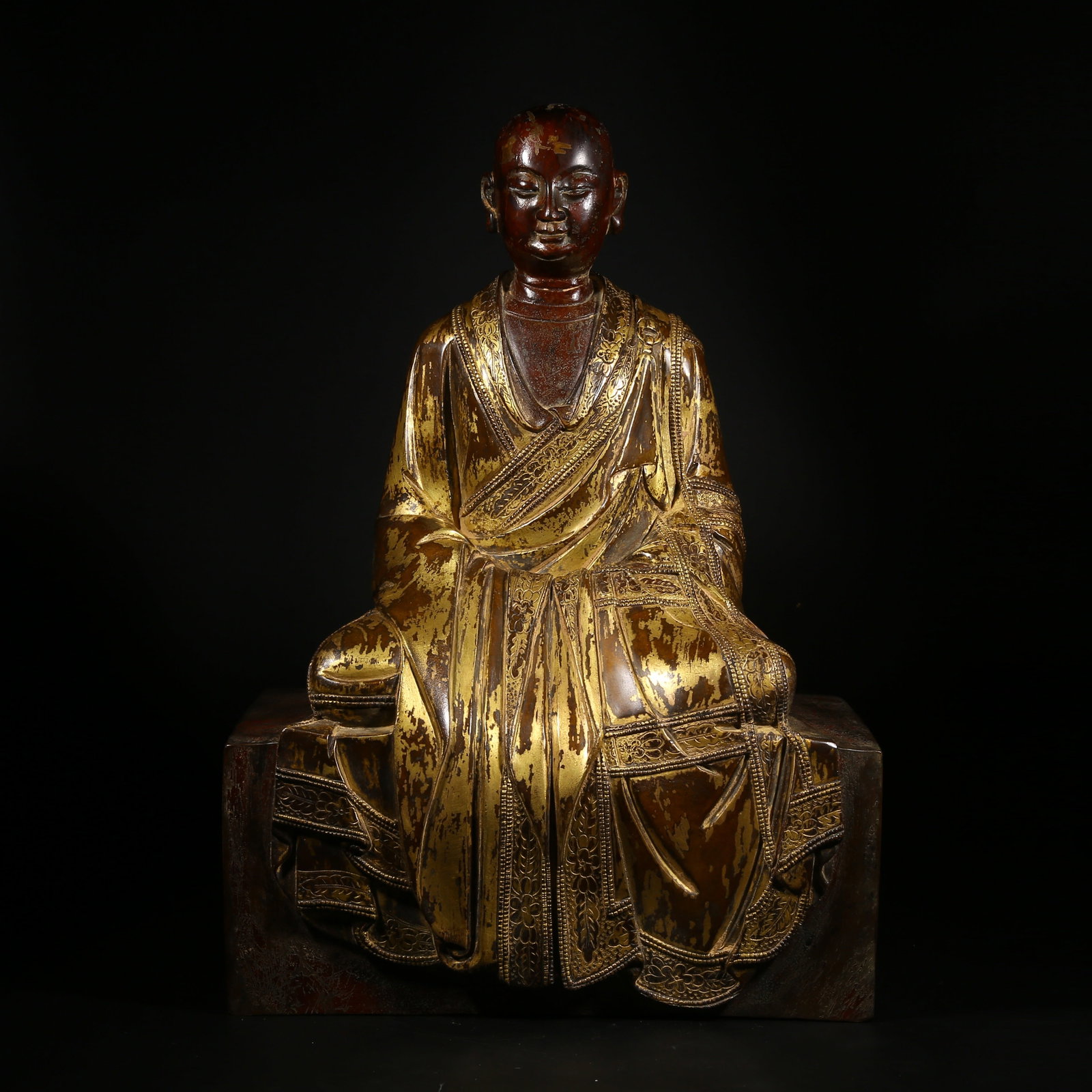 A GILDED BRONZE STATUE OF A GURU (1 of 9)