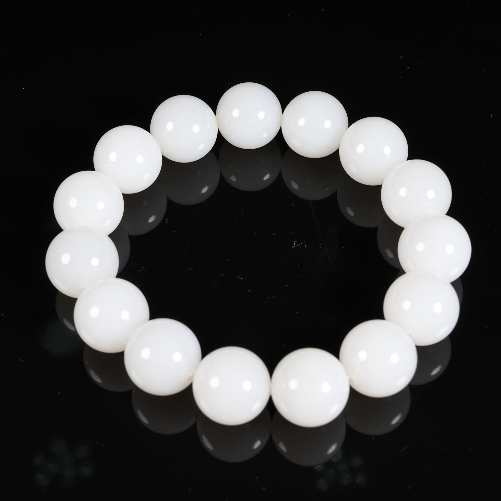 A WHITE HETIAN JADE PRAYER BEAD BRACELET (1 of 9)