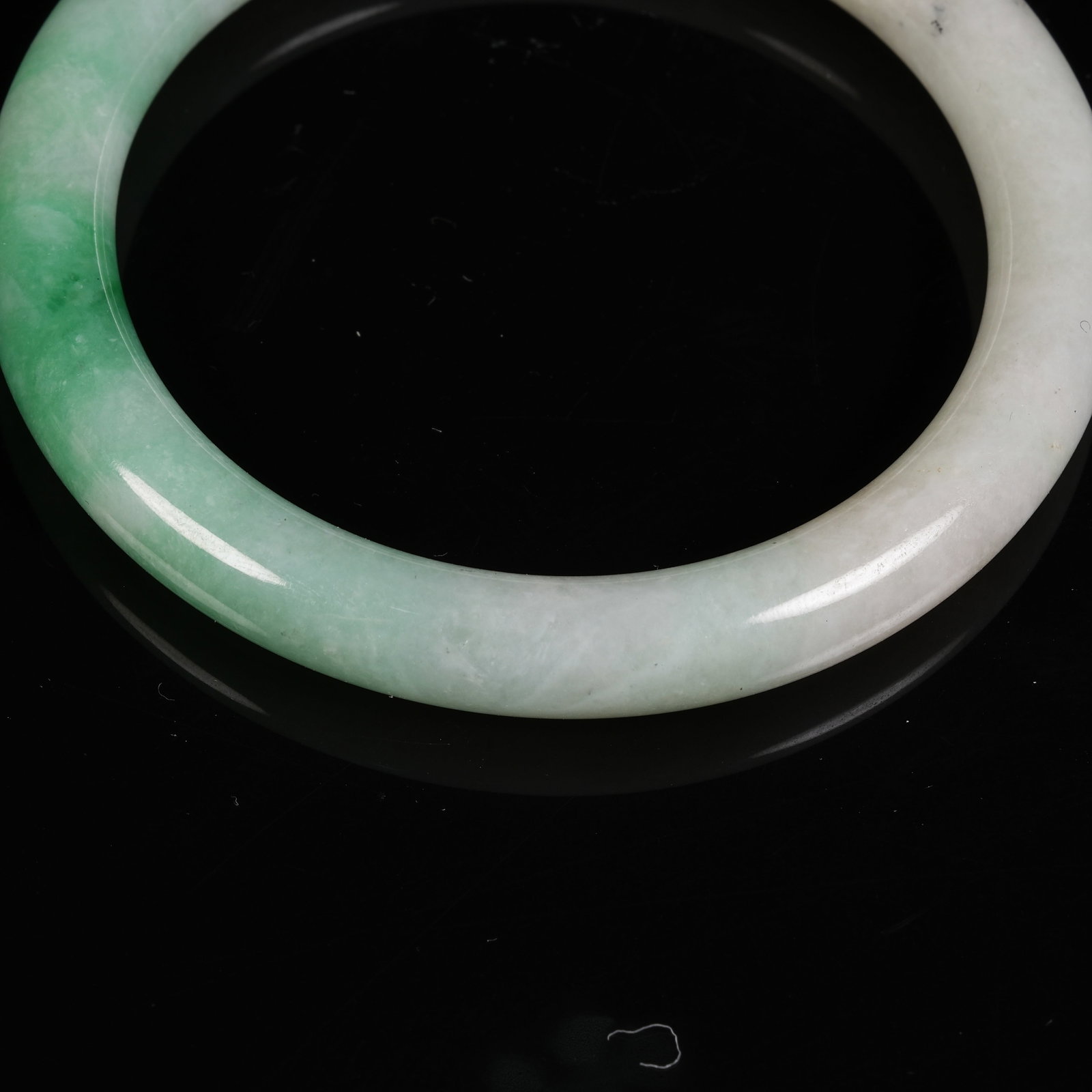 A JADEITE CIRCULAR RING - 5