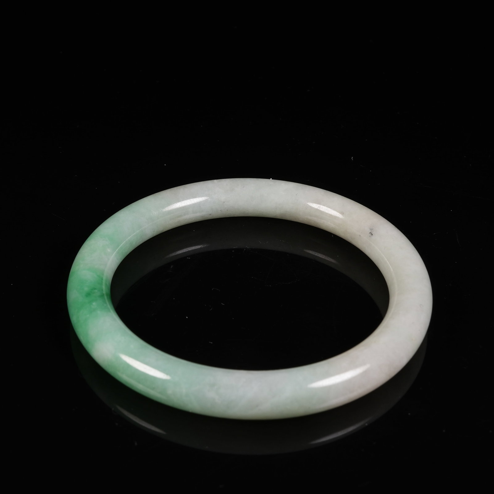 A JADEITE CIRCULAR RING - 6