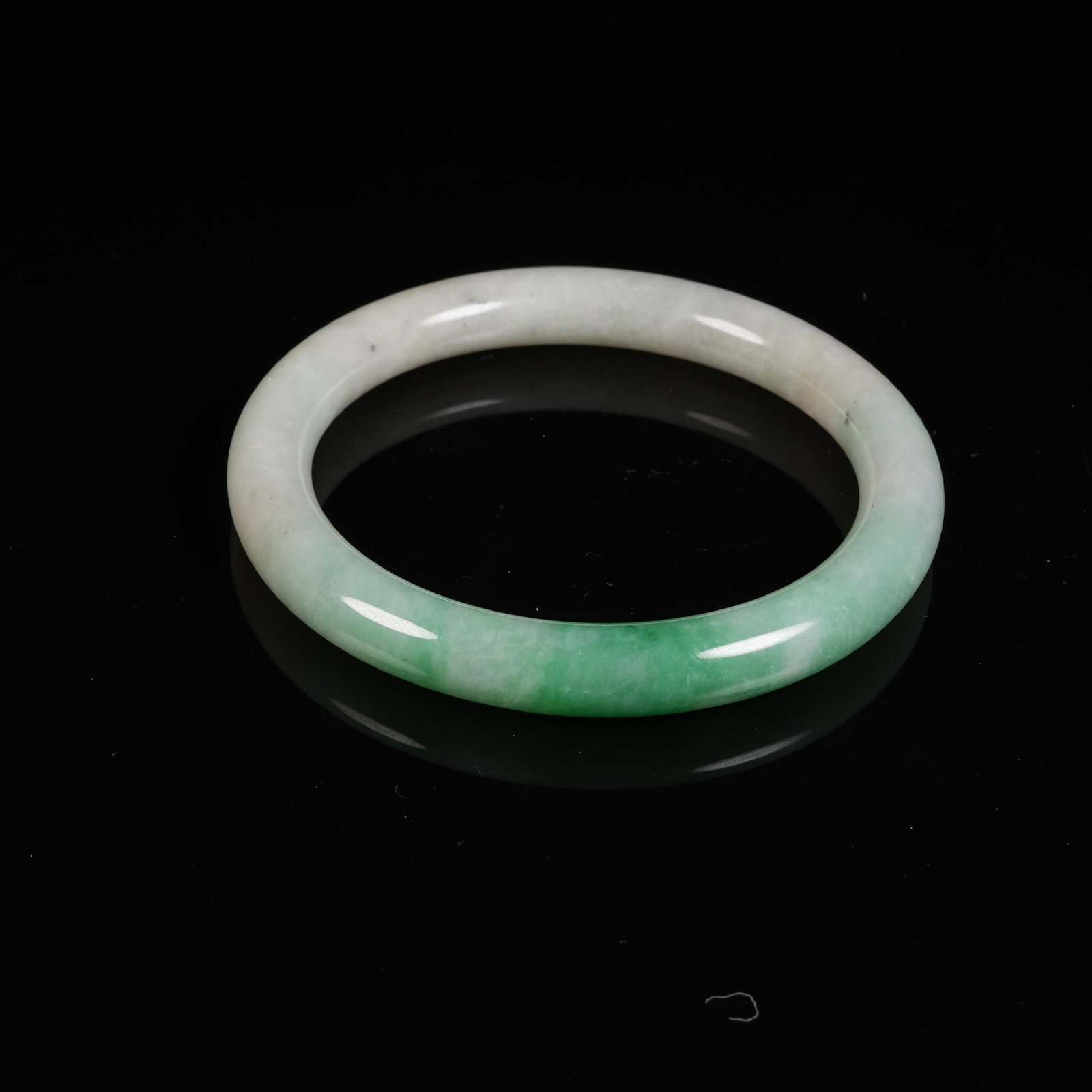 A JADEITE CIRCULAR RING - 7
