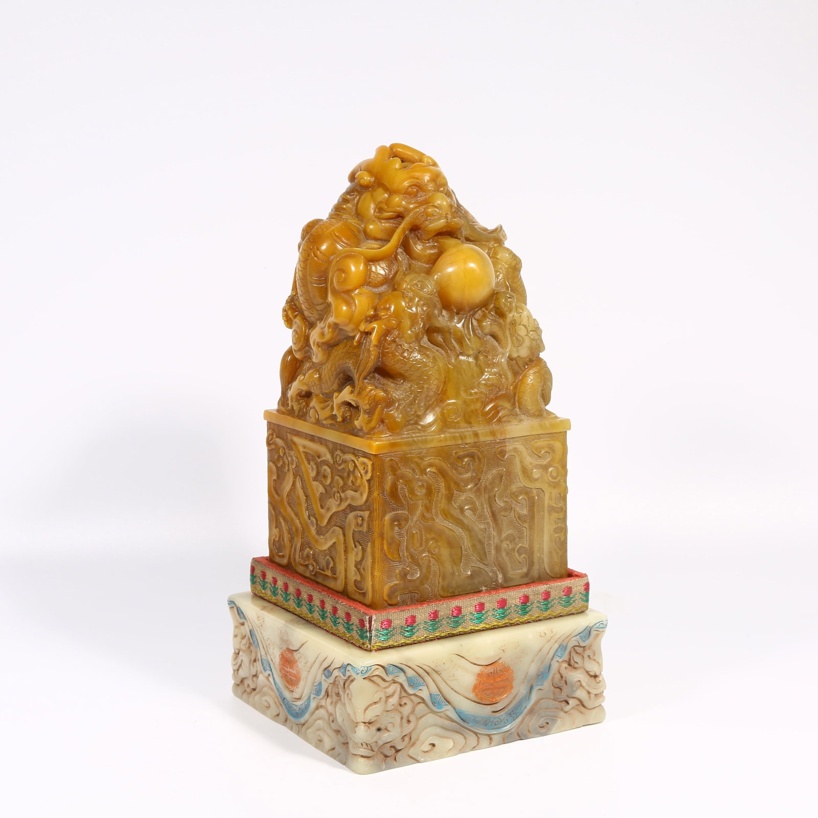A SHOUSHAN TIANHUANG STONE SEAL WITH DRAGON-SHAPED KNOB: Shoushan Tianhuang stone seal with dragon-shaped knob